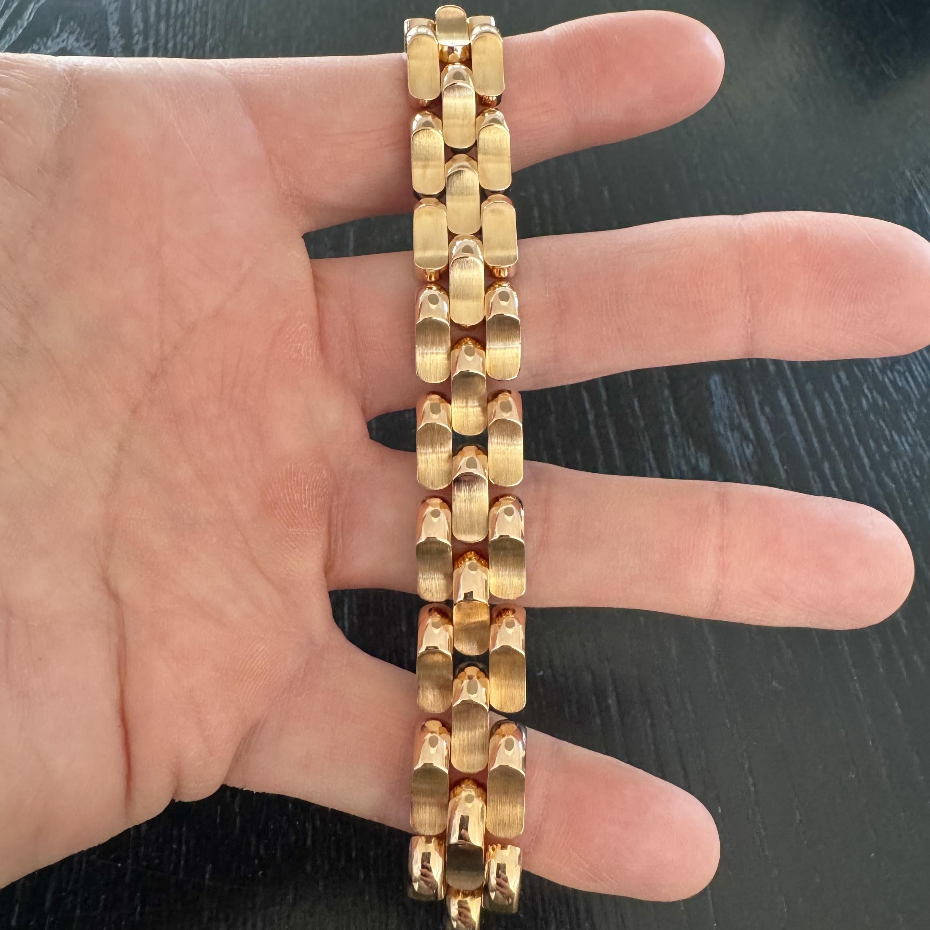 Condition:  Excellent Condition, Professionally Cleaned and Polished
Metal:  18k Gold (Marked, and Professionally Tested)
Weight:  50.1g
Length:  6.5 Inches
Width:  14mm
Closure:  Box Tab Insert with Fold Over Latch
Markings:  