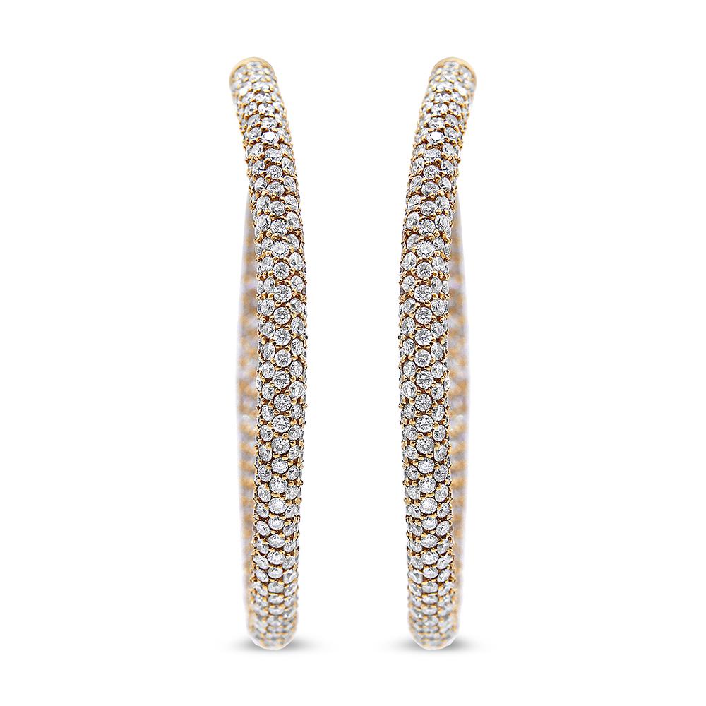 A dewy oval silhouette drips with French pavé-set diamonds giving these 18k rose gold hoop earrings a dazzling modern look that commands attention with their subtle light. These stunning eternity hoop earrings feature 1,268 natural diamonds on the
