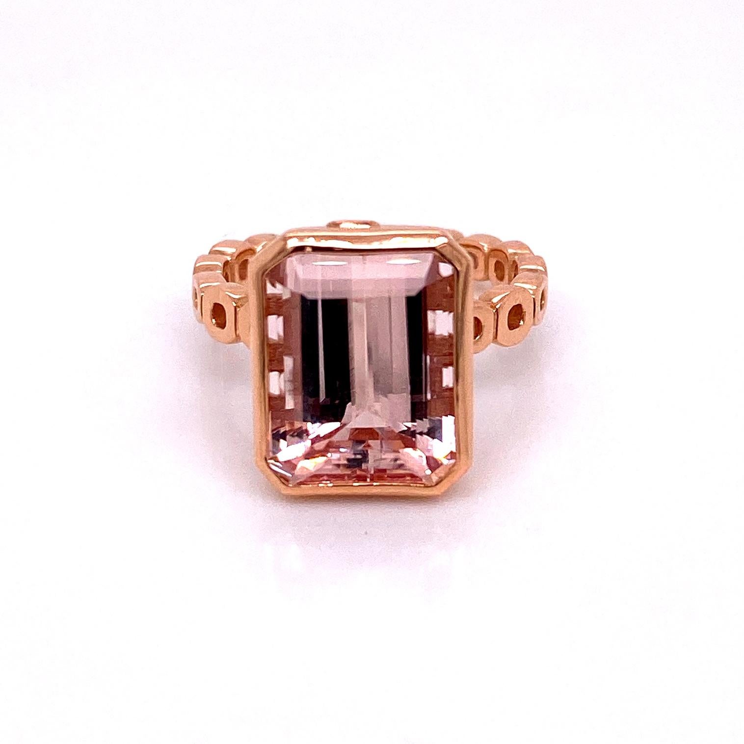 An 18k rose gold ring set with an emerald cut 7.78 carat morganite. Ring size 6.5. This ring was made and designed by llyn strong.
