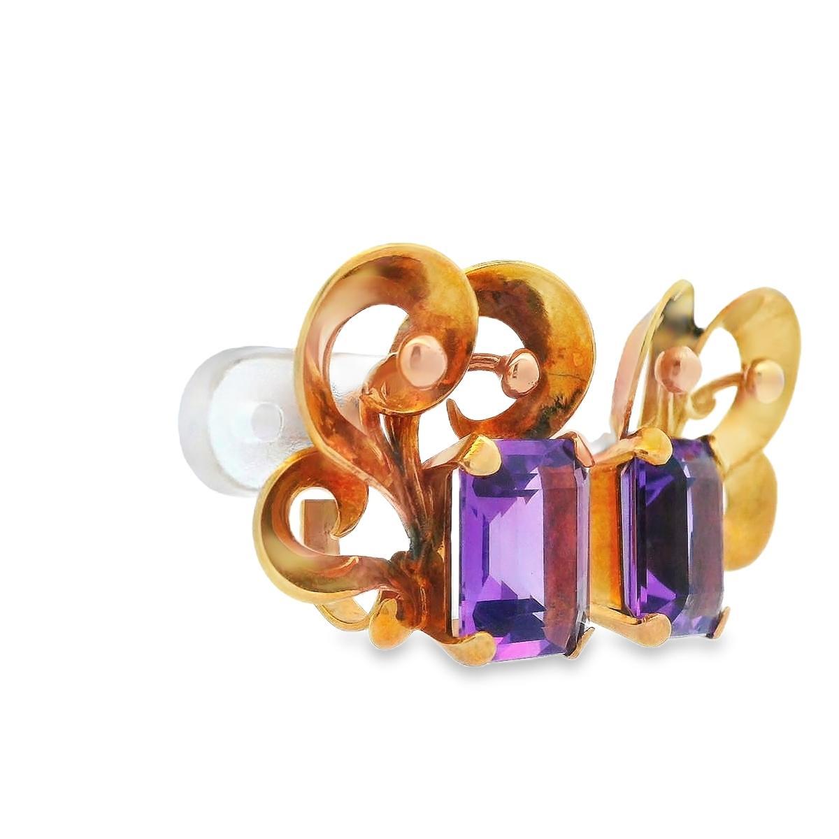 This gorgeous pair of Mid Century Modern earrings feature 9 carats of amethyst and 18k rose gold. The 18k rose gold creates a floral, or a heart shaped, pattern that contrasts beautifully with the purple hues of the amethyst. The skewback design