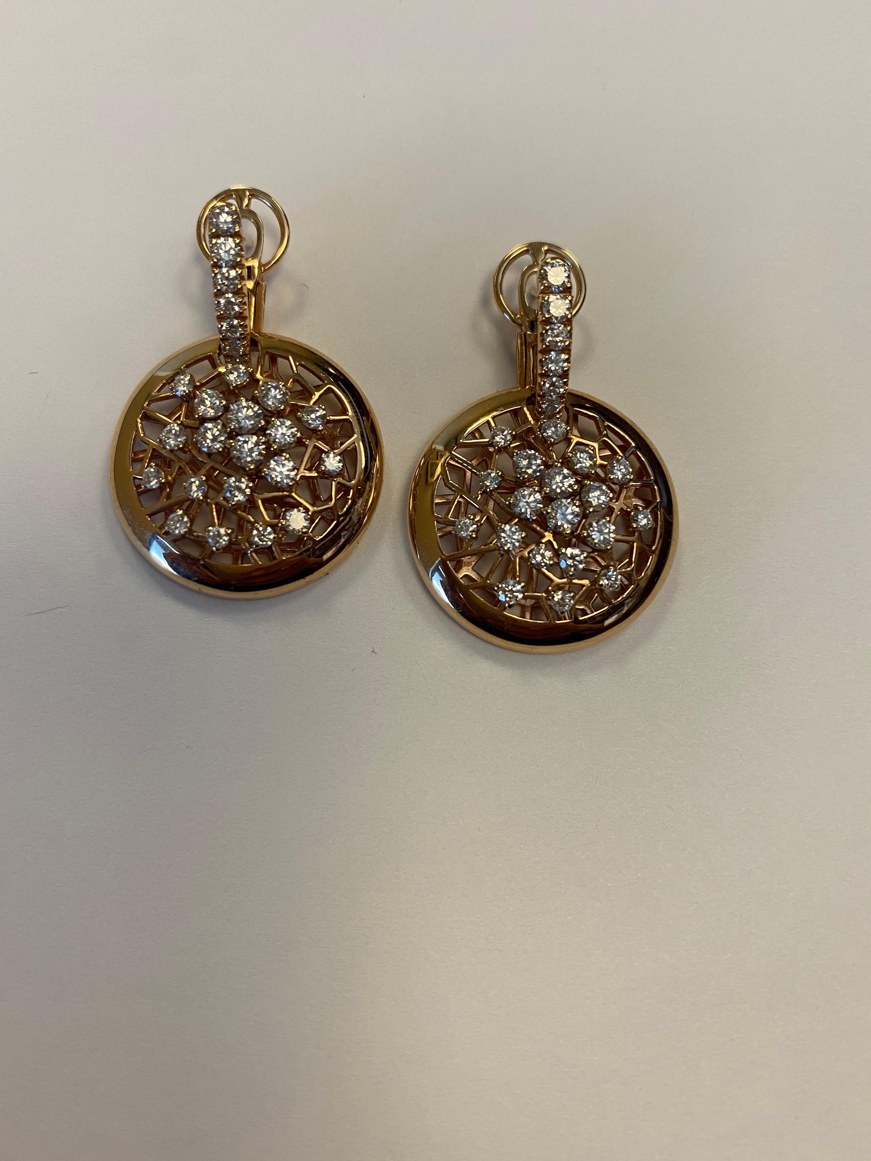 18K rose gold and diamond circular shape drop earrings with 50 full cut round diamonds weighing 1.86cts
Retail $5500