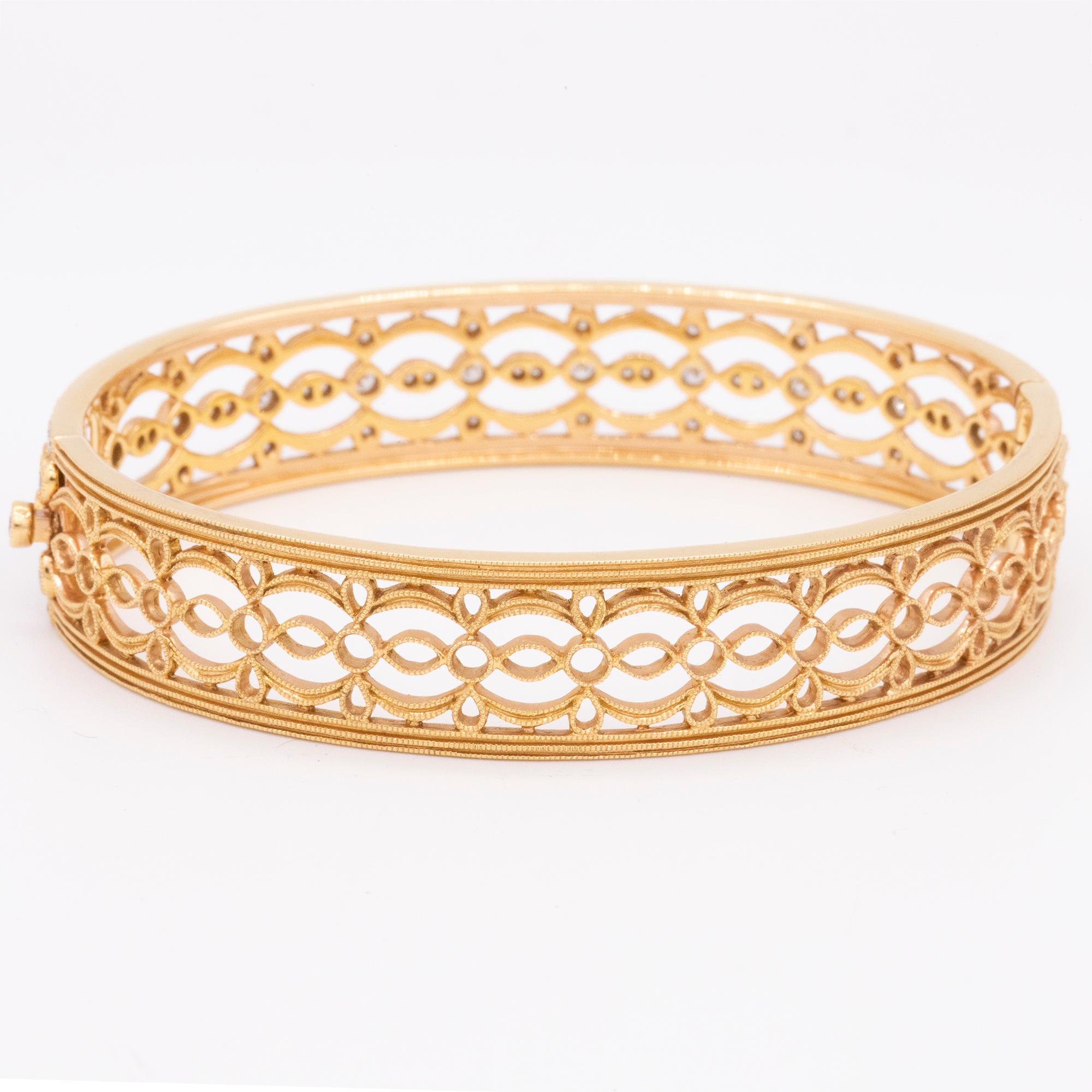 From the Hamilton Jewelers Heritage Collection, this diamond bangle bracelet combines old world details with timeless design. Beautiful filigree work and milgrain edges are in 18k rose gold. This bangle is 12mm wide and showcases 213 round brilliant