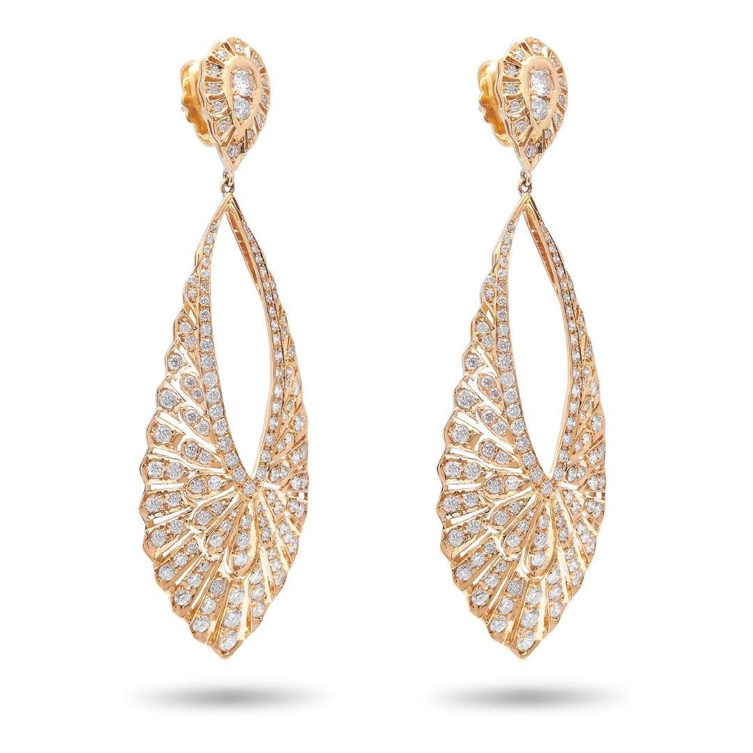A teardrop design have a timeless, elegant appeal that is highly versatile and suitable for a wide range of occasions. This 18k Rose Gold diamond drop earrings have an elegant, slender vintage look to them. Each teardrop shaped dangle shimmers with