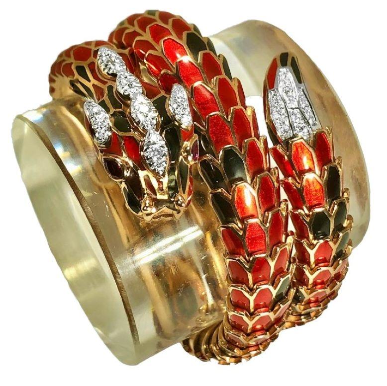 This stunning contemporary Italian wrap around bracelet is crafted in 18k rose gold and in rose gold plated sterling silver. It's head is set with two pear shape ruby eyes. Both head and tail are set with a total of thirty six brilliant cut diamonds