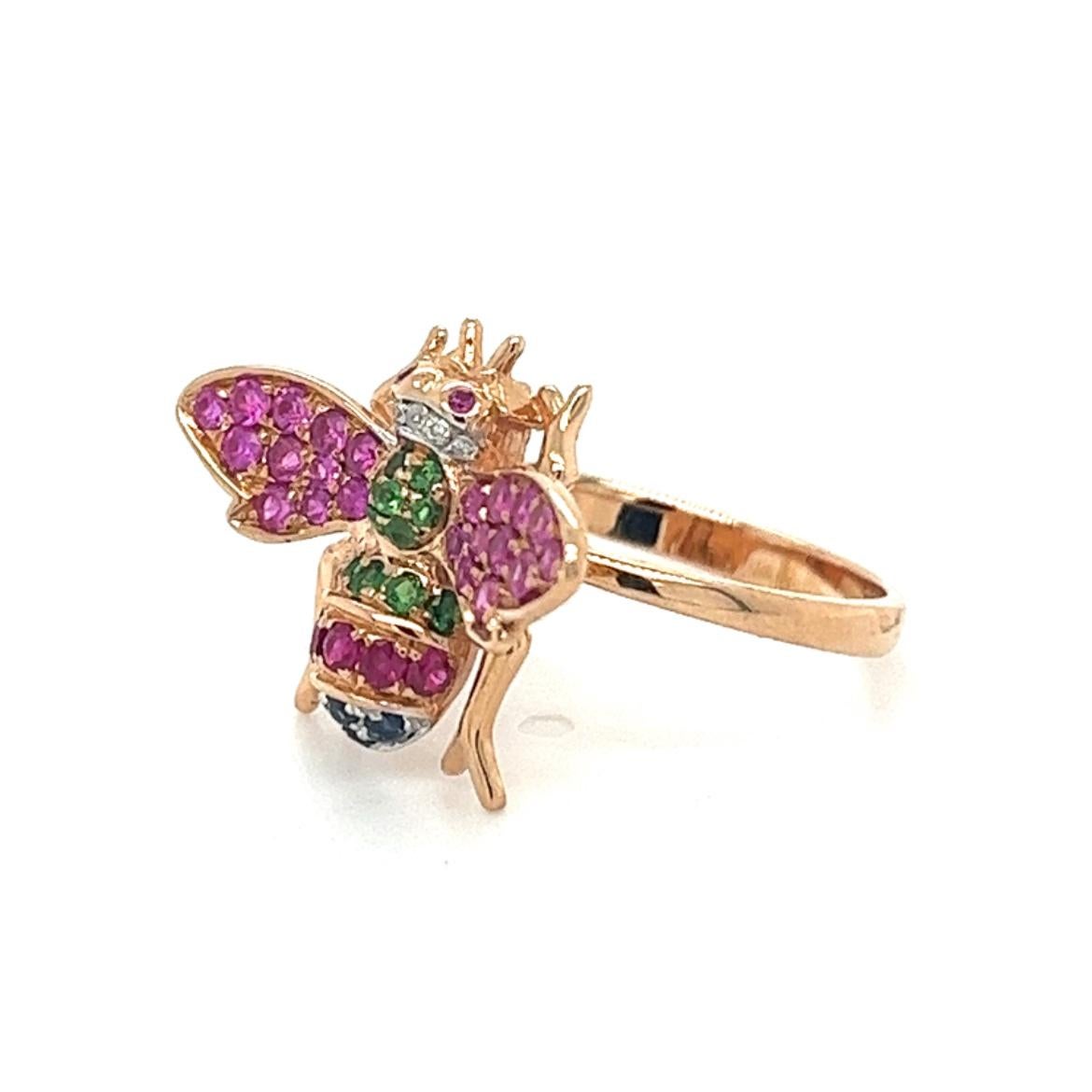 18K Rose Gold Bee Ring with
Diamonds & Pink Sapphires 
& Green Garnets

7 Rubies - 0.12 CT 
4 Blue Sapphires - 0.05 CT 
5 Diamonds - 0.02 CT 
12 Green Garnets - 0.13 CT 
22 Pink Sapphires - 0.31 CT 
18K Rose Gold -  4.07 GM

Discover the essence of