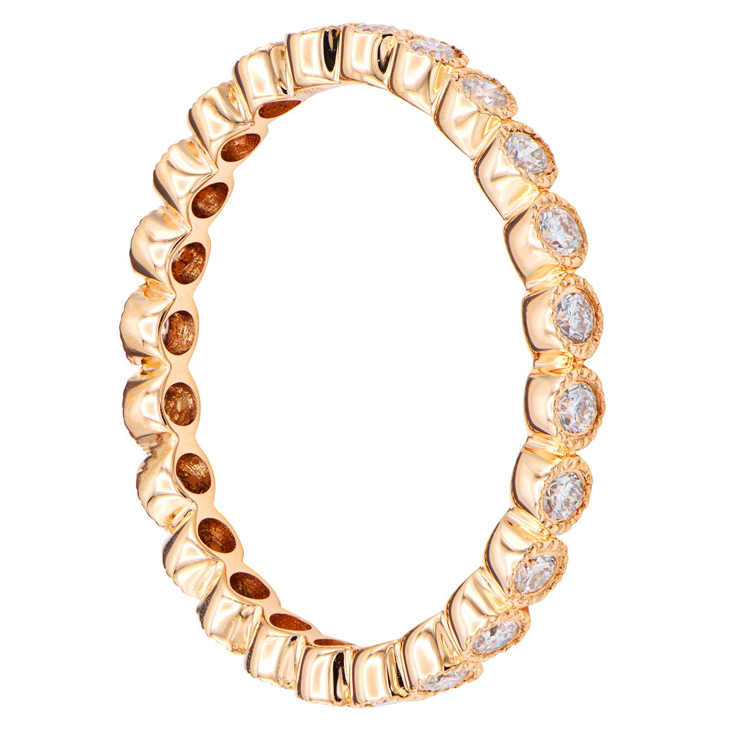 This stunning 18K rose gold eternity ring is made from 1.9 grams of gold. There are 23 round VS2, G color diamonds all the way around the ring totaling 0.44 carats. The gold around the diamonds has beautiful details to create this bezel setting.