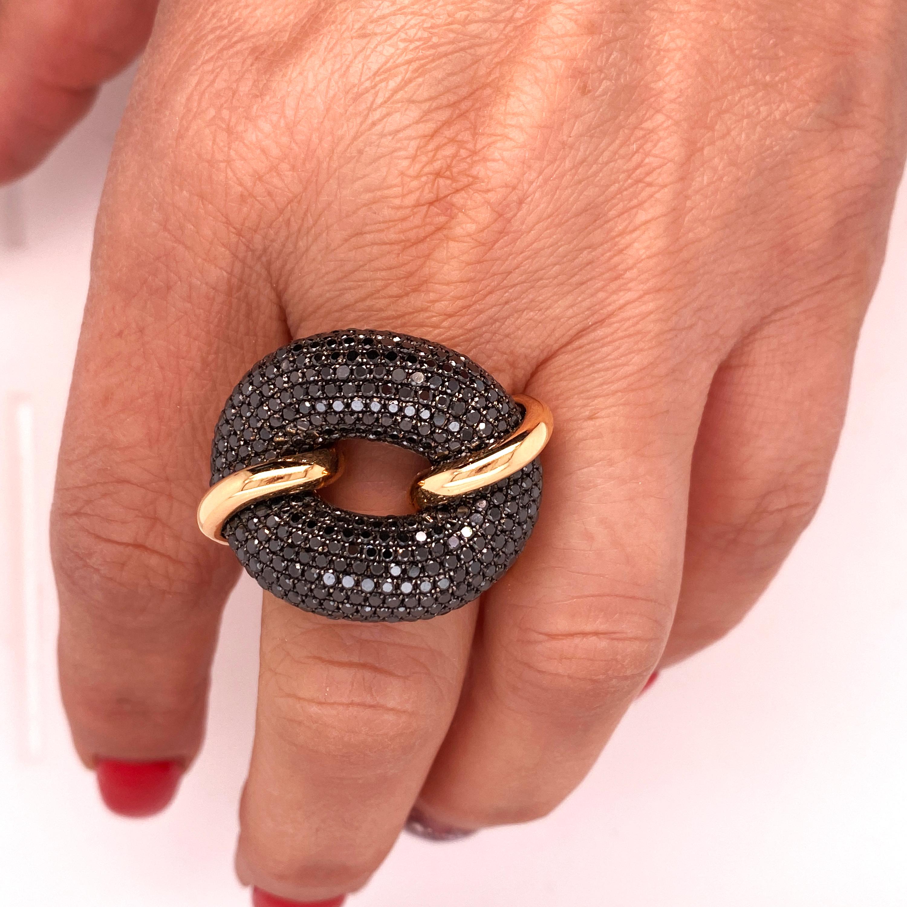 18K Rose Gold Black Diamonds Oval Face Cocktail Ring

6.50 carat apprx. Black Diamonds total weight

Ring face is an oval with black diamonds pavé set. Band of the ring also has a link-like design

Ring face is 0.96 inch in width. 0.50 inch band