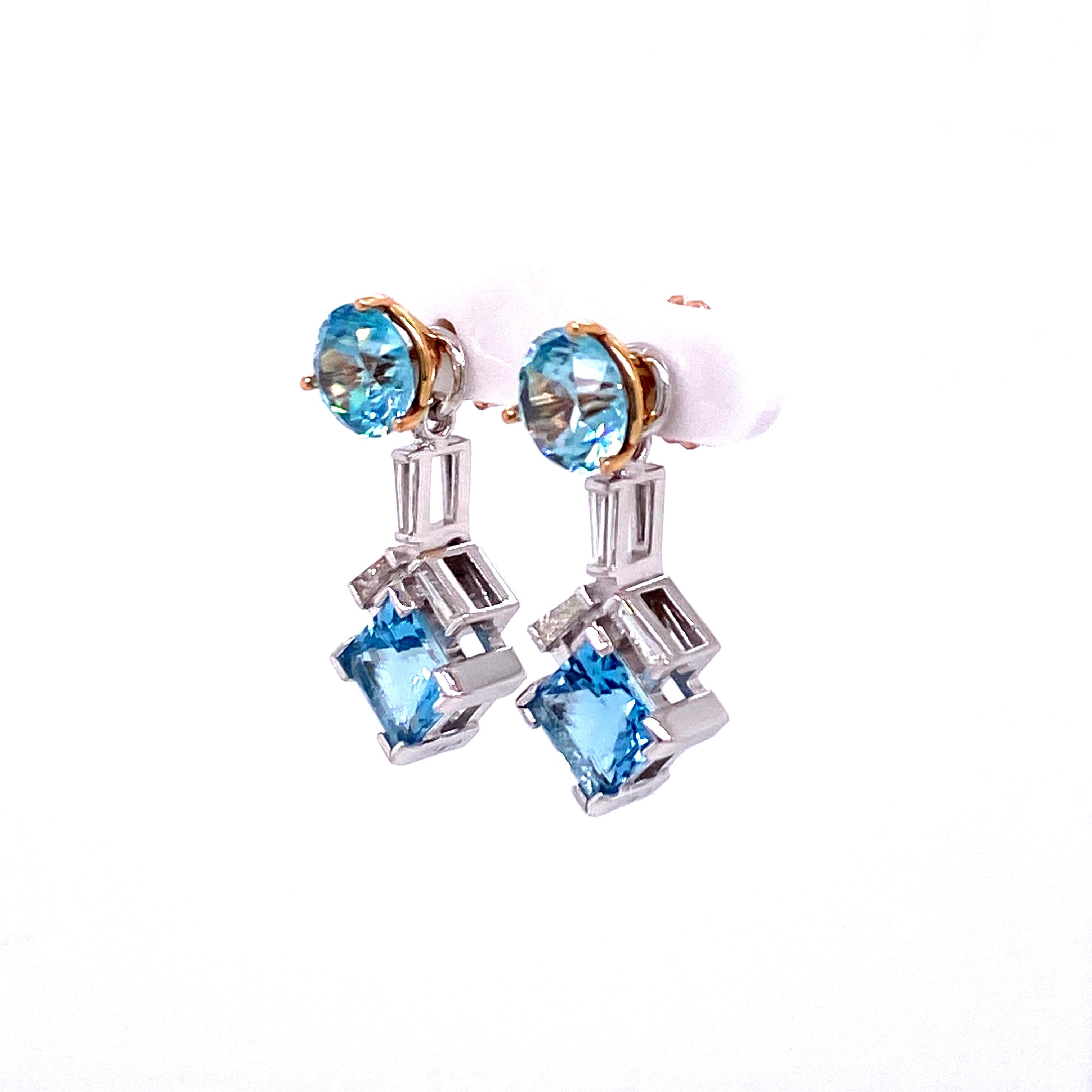  A pair of 18k rose gold martini head studs with 8.8mm old mine cut blue zircons, 7.06 carats. With a pair of 18k white gold earring jackets featuring a pair of princess cut 8mm aquamarine, 4.78 total carat weight, and accented with 0.55 total carat
