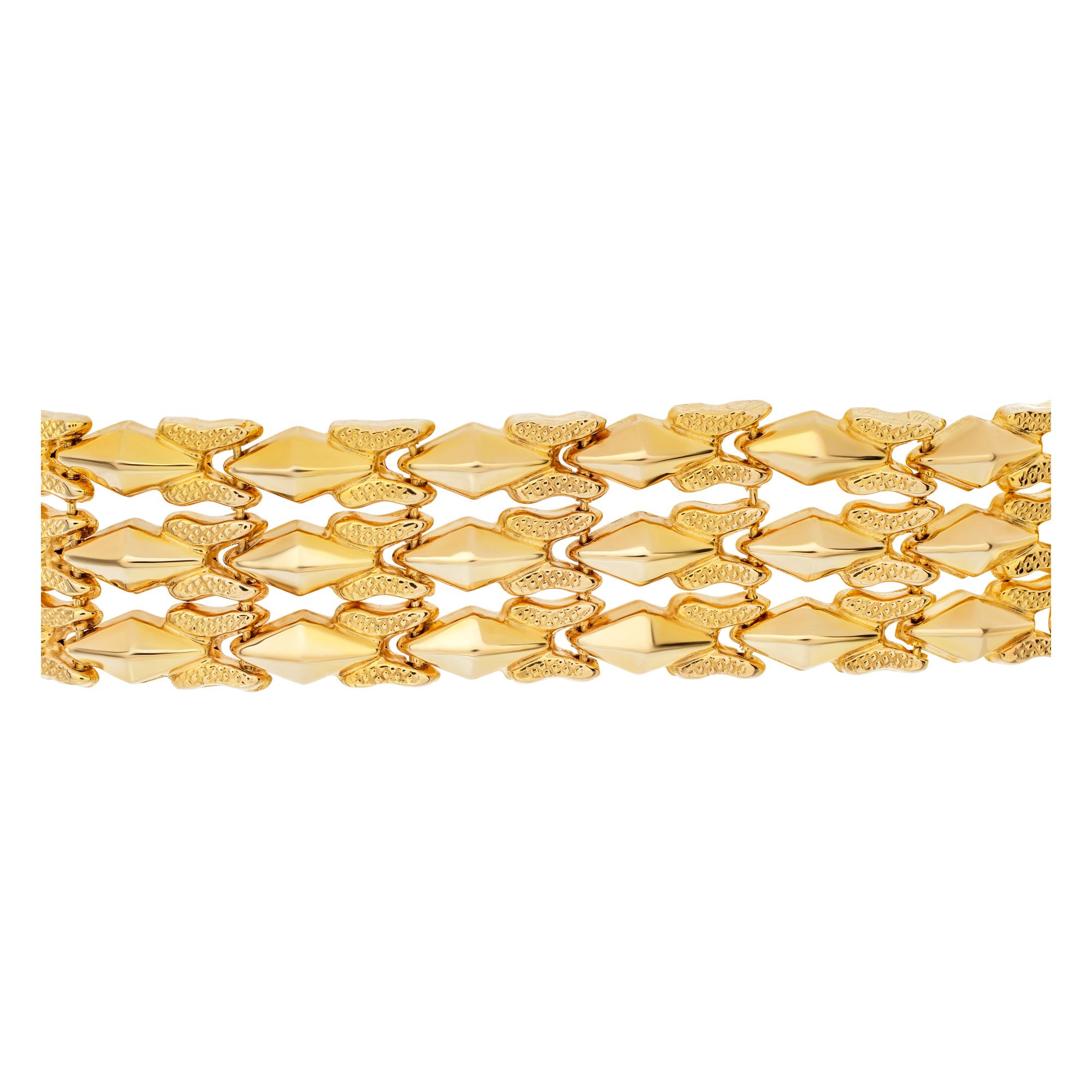 Beautiful wide flexible 18k rose gold bracelet with white gold clasp. Width of bracelet is 0.67inches, length 7.5 inches.
