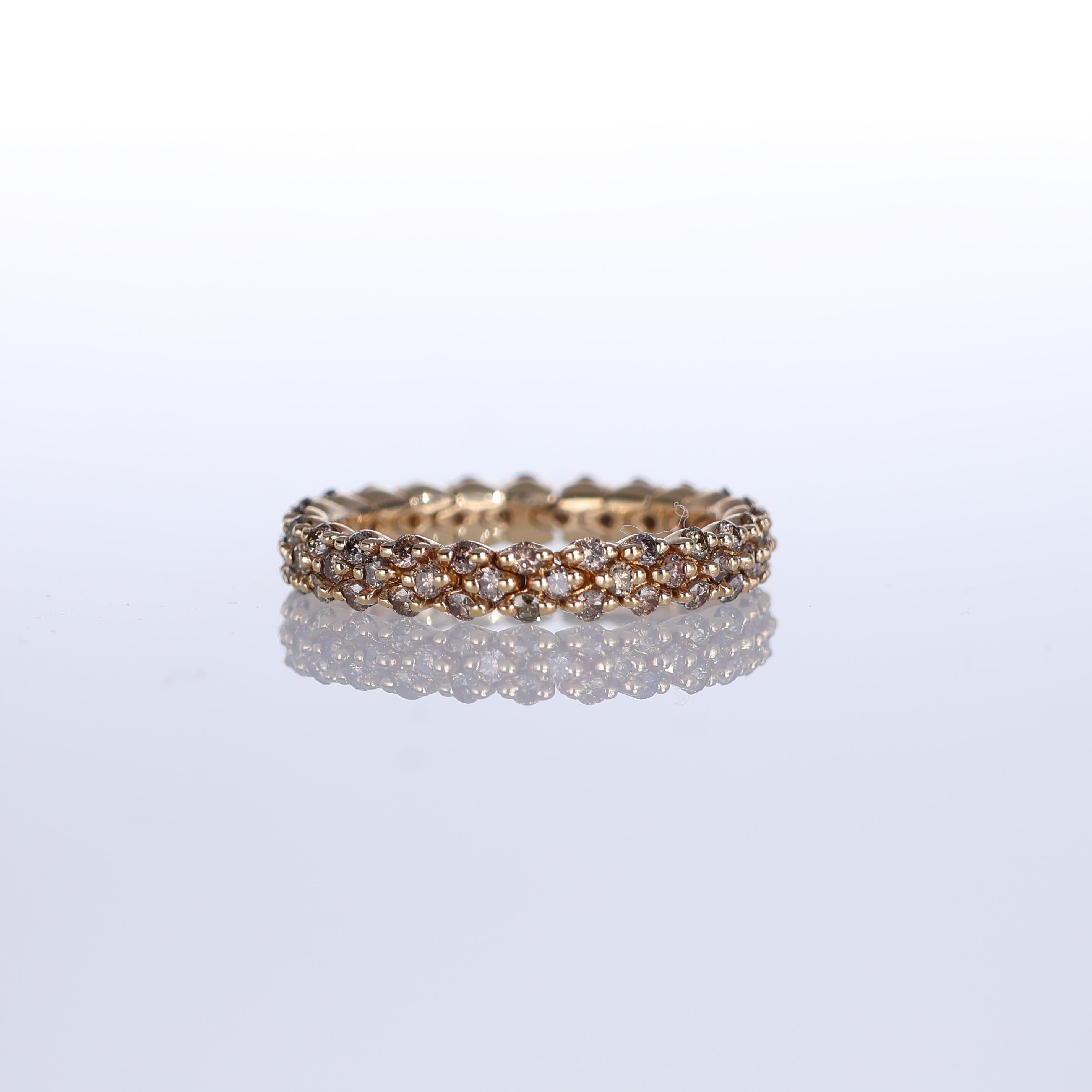 A refined eternity band crafted in 18K rose gold, featuring 1.08 carats of brown diamonds arranged in an intricate, classic design. The warm glow of rose gold enhances the natural depth of the brown diamonds, creating a sophisticated and timeless
