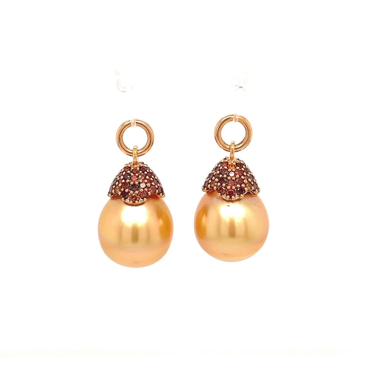 A pair of 18k rose gold studs bezel set with 1.57 total carat weight round rose cut brown diamonds, with a pair of 12x15.5mm golden south sea pearls with an 18k rose gold cap set with 104 cabernet colored diamonds, .86tcw. These earrings were made