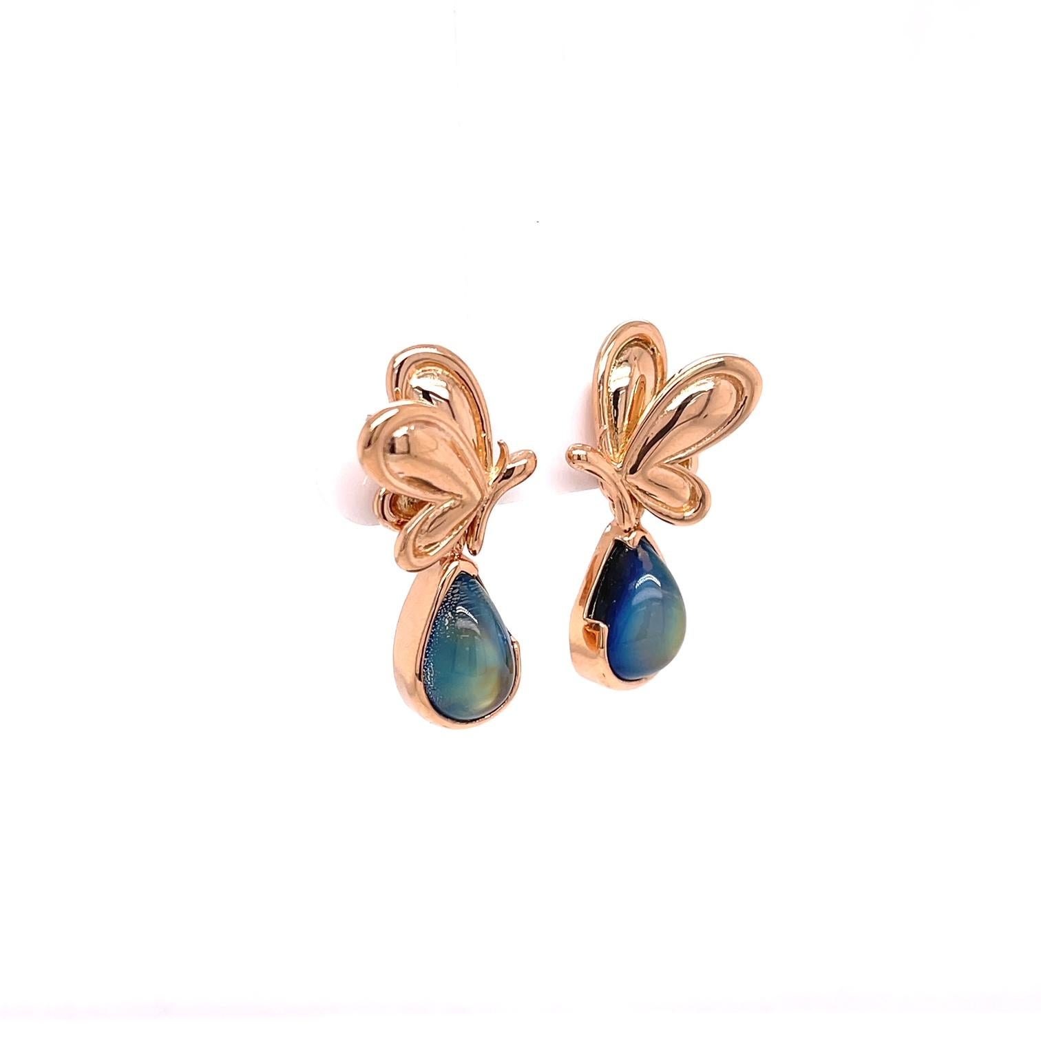 A pair of 18k rose gold butterfly studs with a pair of 18k rose gold jackets set with 8.31 total carats of rainbow moonstone pear shaped cabochons, 12.4mm x 8mm. These earrings were made and designed by llyn strong.
Items sold separately upon