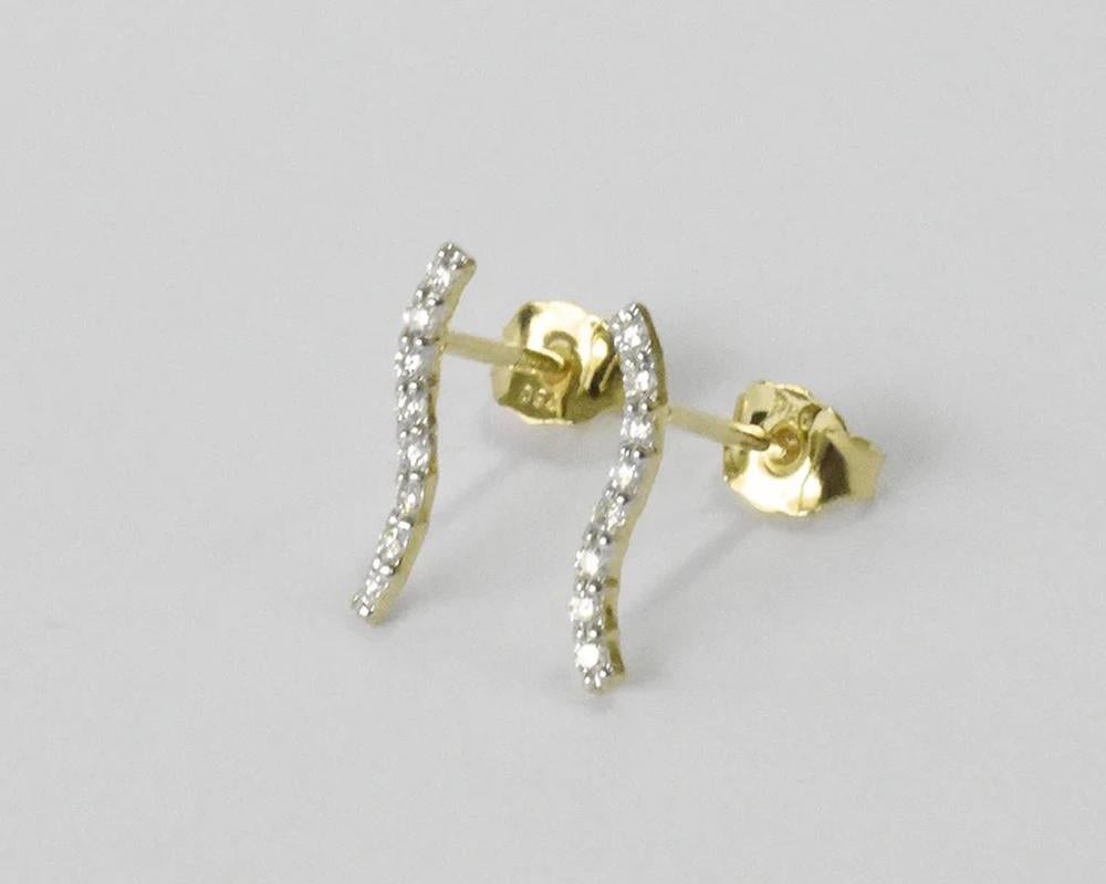 cross curved diamond earrings