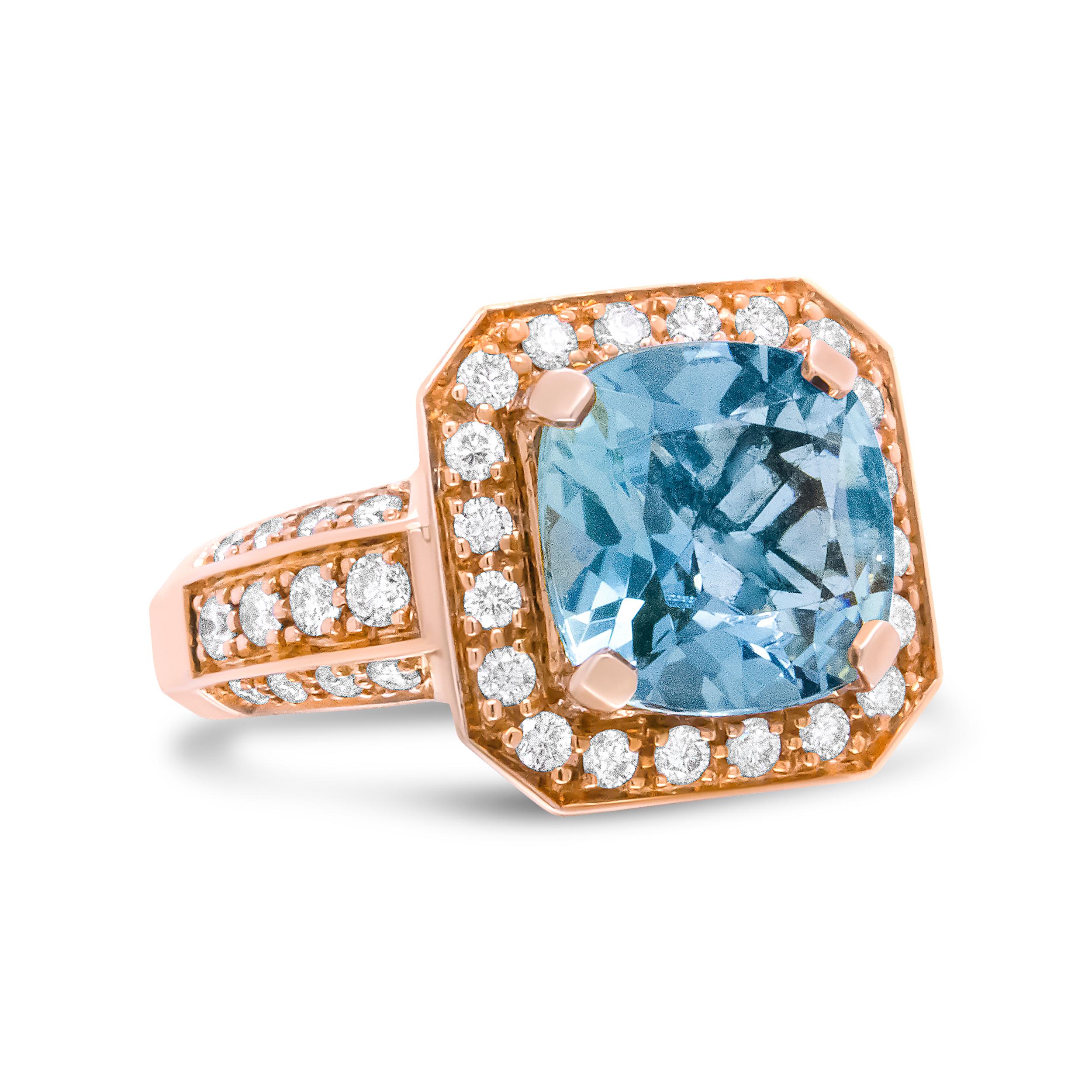 Natural white diamonds dance up on luxurious rose gold to flank a glamorous aquamarine cushion shaped gemstone. This beautiful blue stone is 10x10mm and sits as the central motif on this 18k rose gold ring. The total diamond weight of this piece is