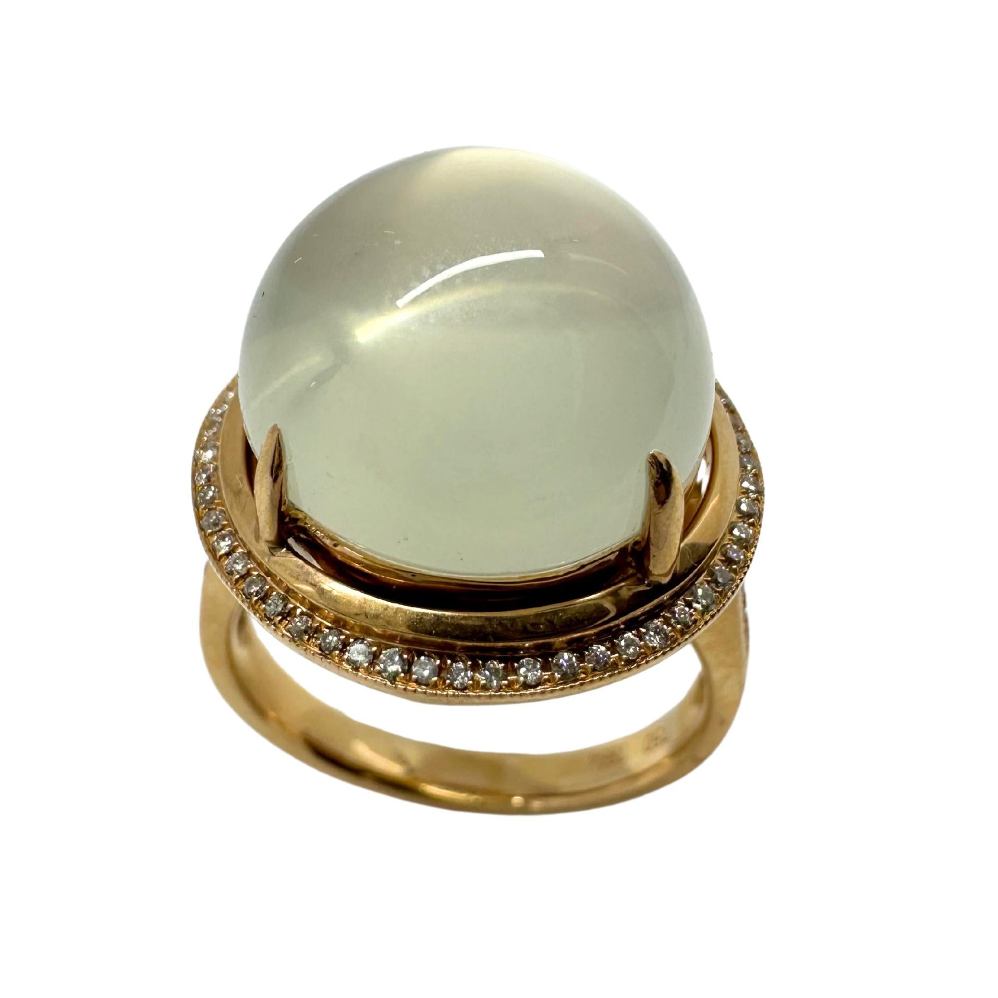 Indulge in the exquisite beauty of this 18K Rose Gold Diamond and Moonstone Cocktail Ring. Crafted from 18k rose gold and boasting 0.30 carats of dazzling diamonds, the ring also features a stunning 14.51 carat moonstone center. In good condition