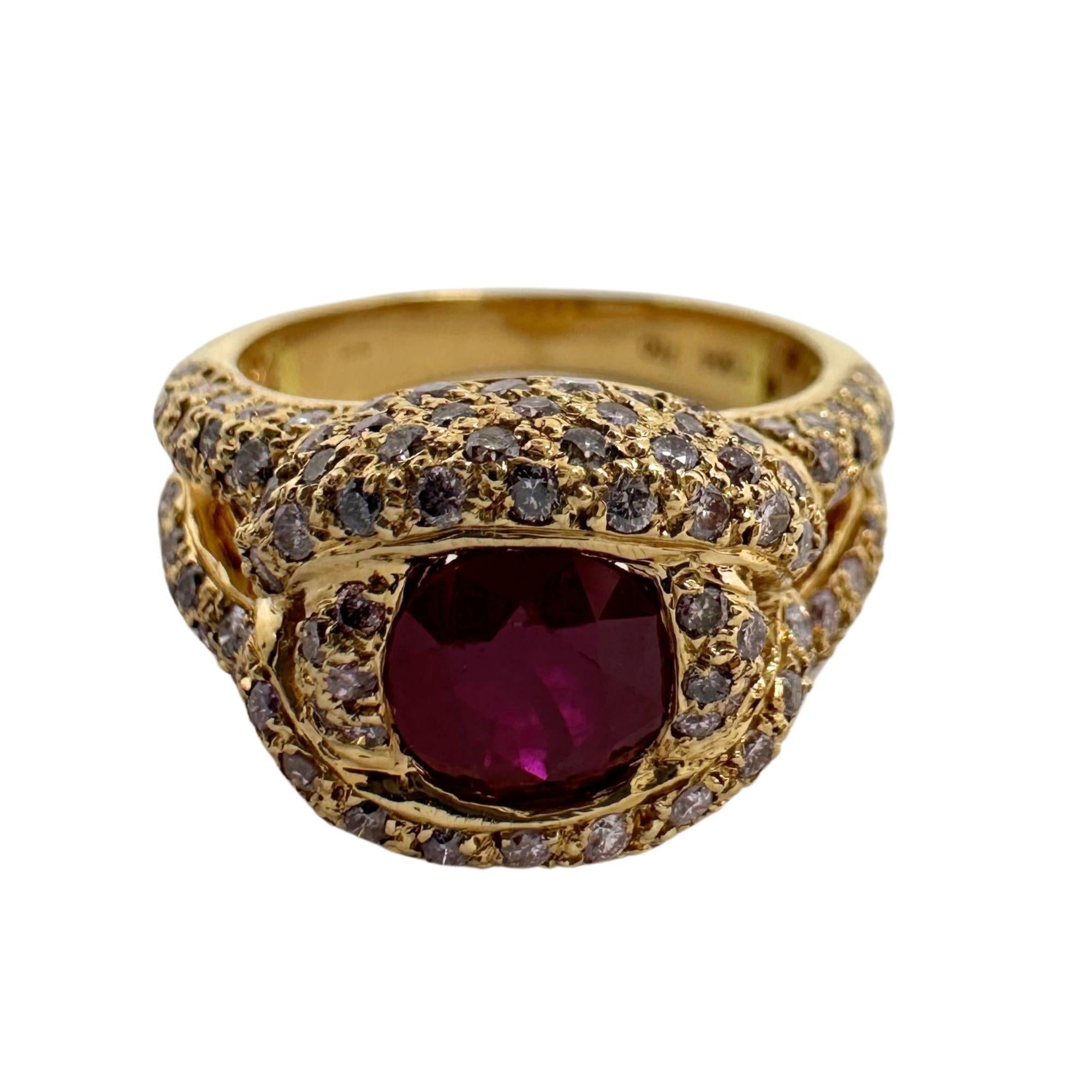 This stunning ring is set in 18k rose gold setting and weighs 8 grams. There is a beautiful 1.29 carat ruby in the center surrounded by 1.29 carats of diamonds.

18K Rose Gold Diamond and Ruby Ring
Condition: In good condition with some minor