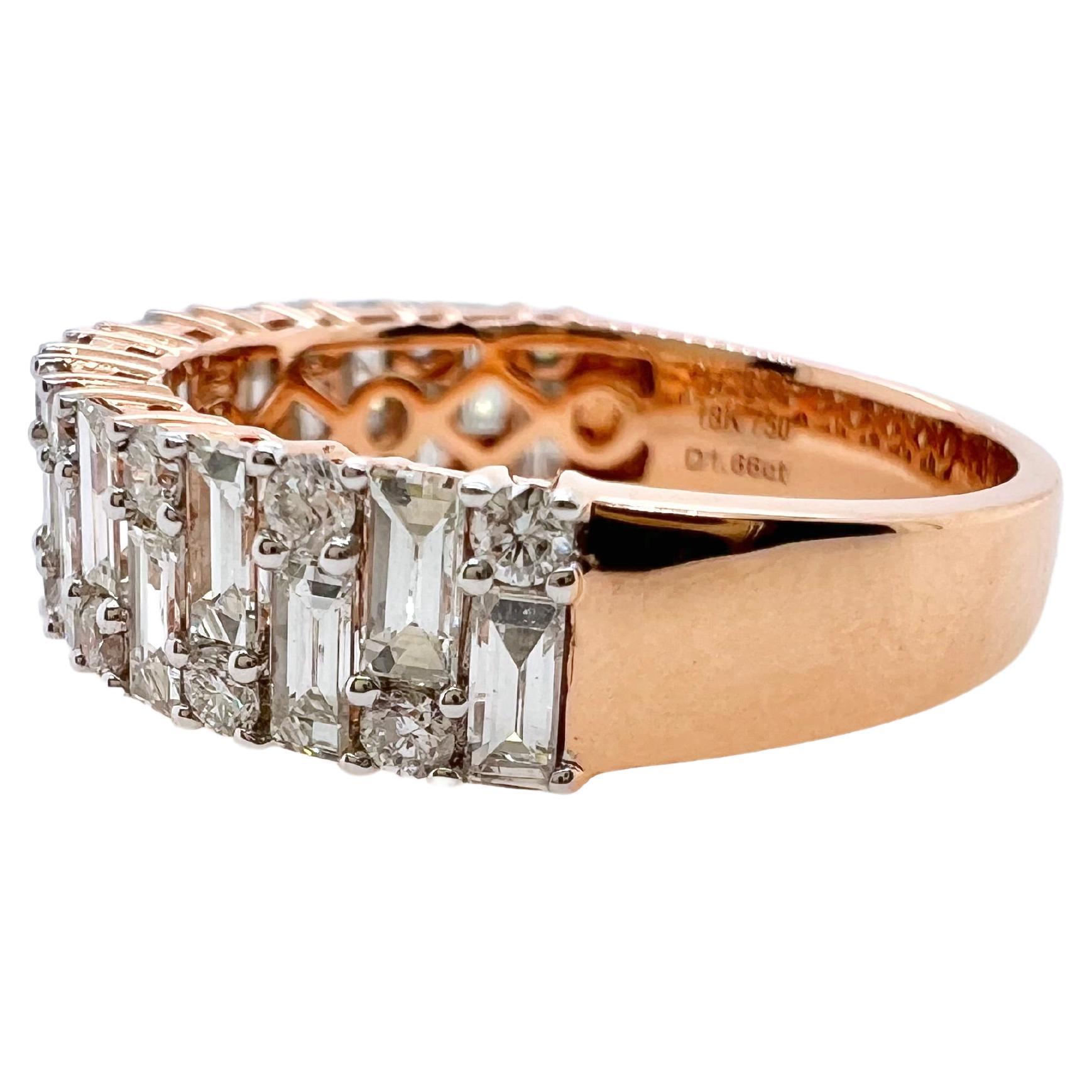 This diamond band has a classic feel, yet with a slight contemporary twist.  The round diamonds are strategically set
amongst the baguettes to give a unique pattern that is timeless.  The band is set in 18k rose gold to give a different
aesthetic