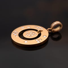 Pendentif circulaire en or rose 18k avec diamant