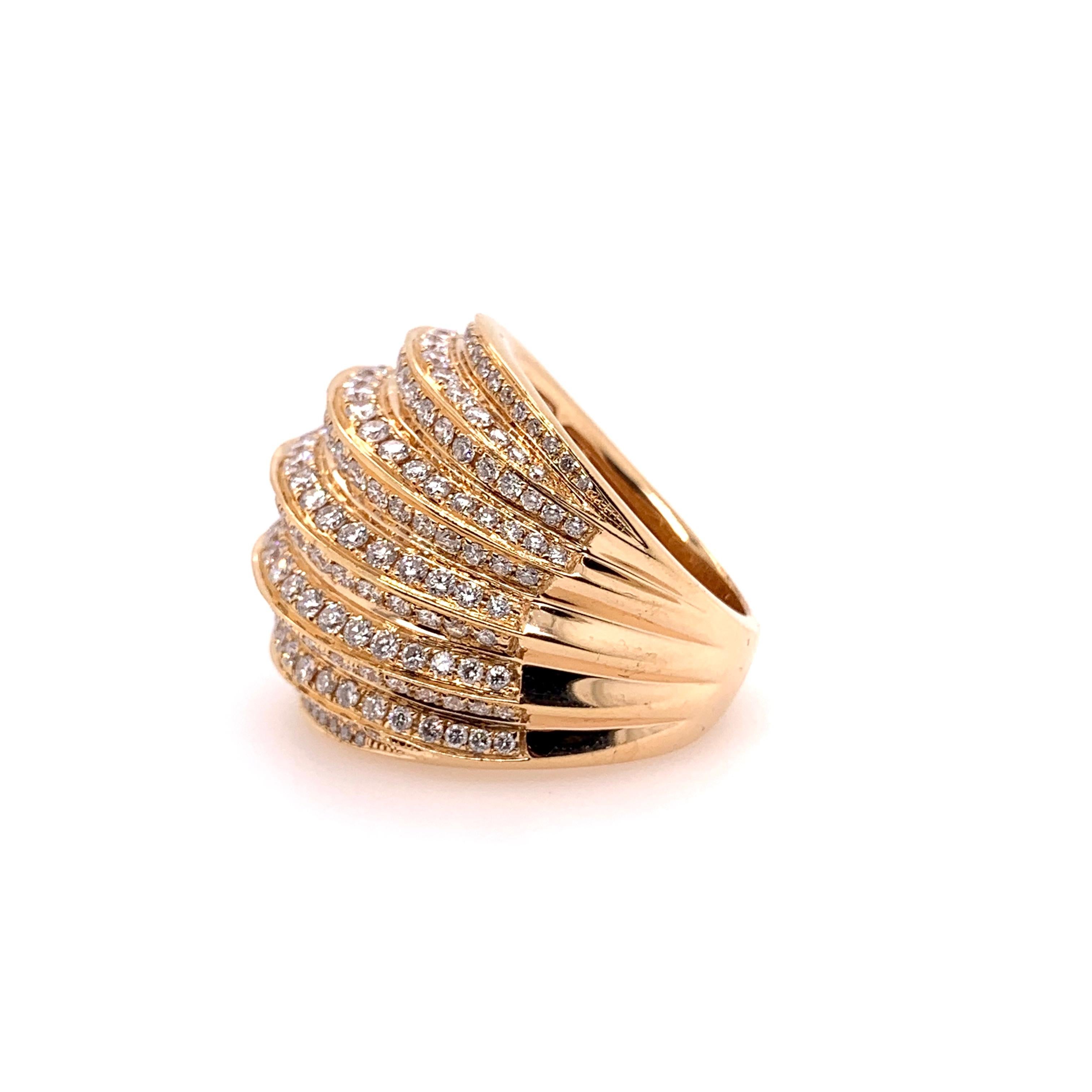 This gorgeous 18k rose gold ring was inspired from the concave shaped shells and waves of the ocean.  With over 4.24 cts of round brilliant diamonds, this masterpiece will be the wearable art for your finger that will complement any attire in a