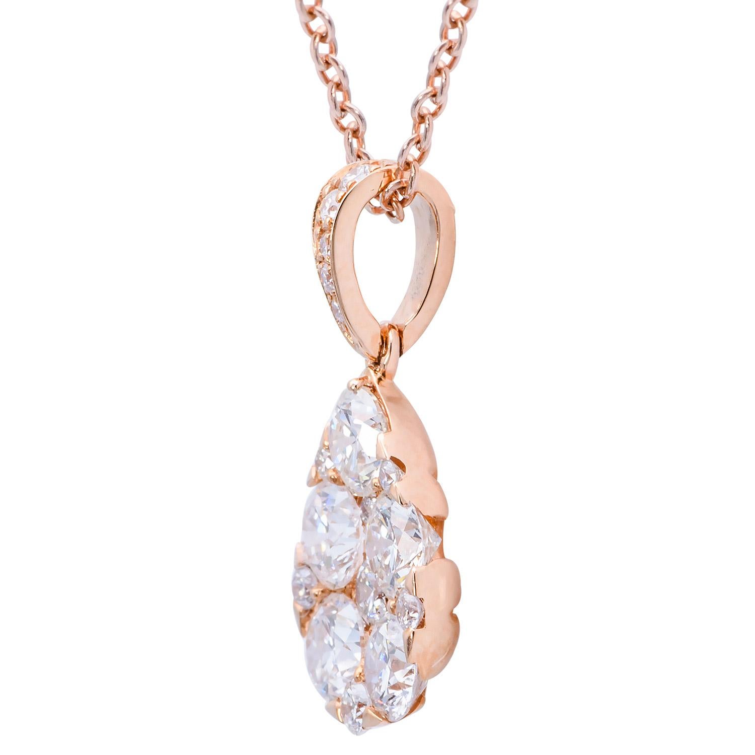 This stunning diamond pendant is made from 17 VS2, G color diamonds totaling 1.02 carats which form a tear drop shape hung from a diamond-covered bail. The diamonds are set in 1.2 grams of 18 karat rose gold. This beautiful pendant is hung from an