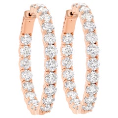 Boucles d'oreilles en or rose 18K avec diamants