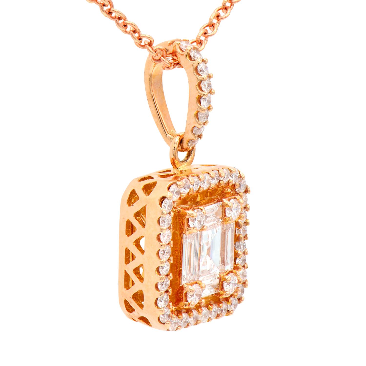 This unique and beautiful pendant looks like an emerald-cut diamond but is actually made of smaller diamonds to appear in an emerald shape. It is then surrounded by a round diamond halo and hung from a diamond-covered bail. There are 5 baguette