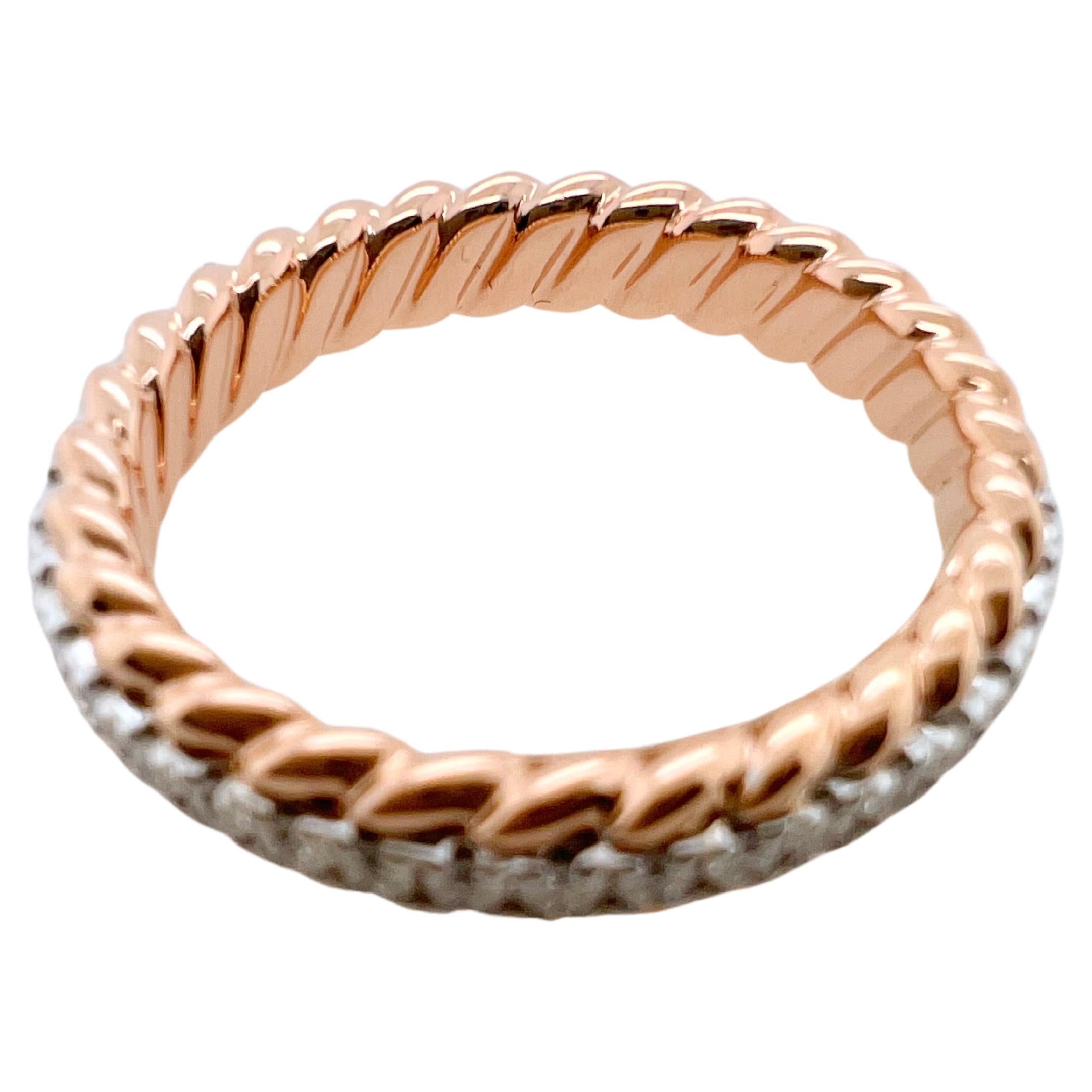 This amazing band will be your go to favorites.  This individual band is made in 18k rose gold with round brilliant diamonds prong set.  The outer edges have a unique rope style trim that give texture and character.  The solid gold is made sturdy so