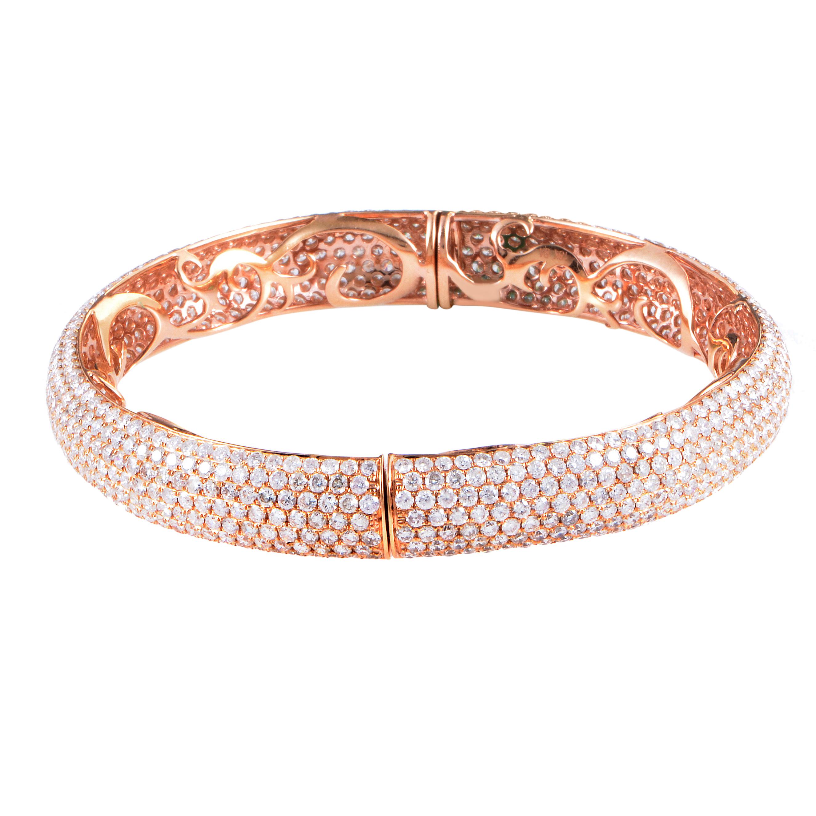 This absolutely gorgeous diamond bracelet is almost magical in its grace and beautiful design. A radiant ~18.80ct of brilliant-cut diamonds pave the exterior of the glamorous 18K rose gold, while the delicately engraved inside captivates with it