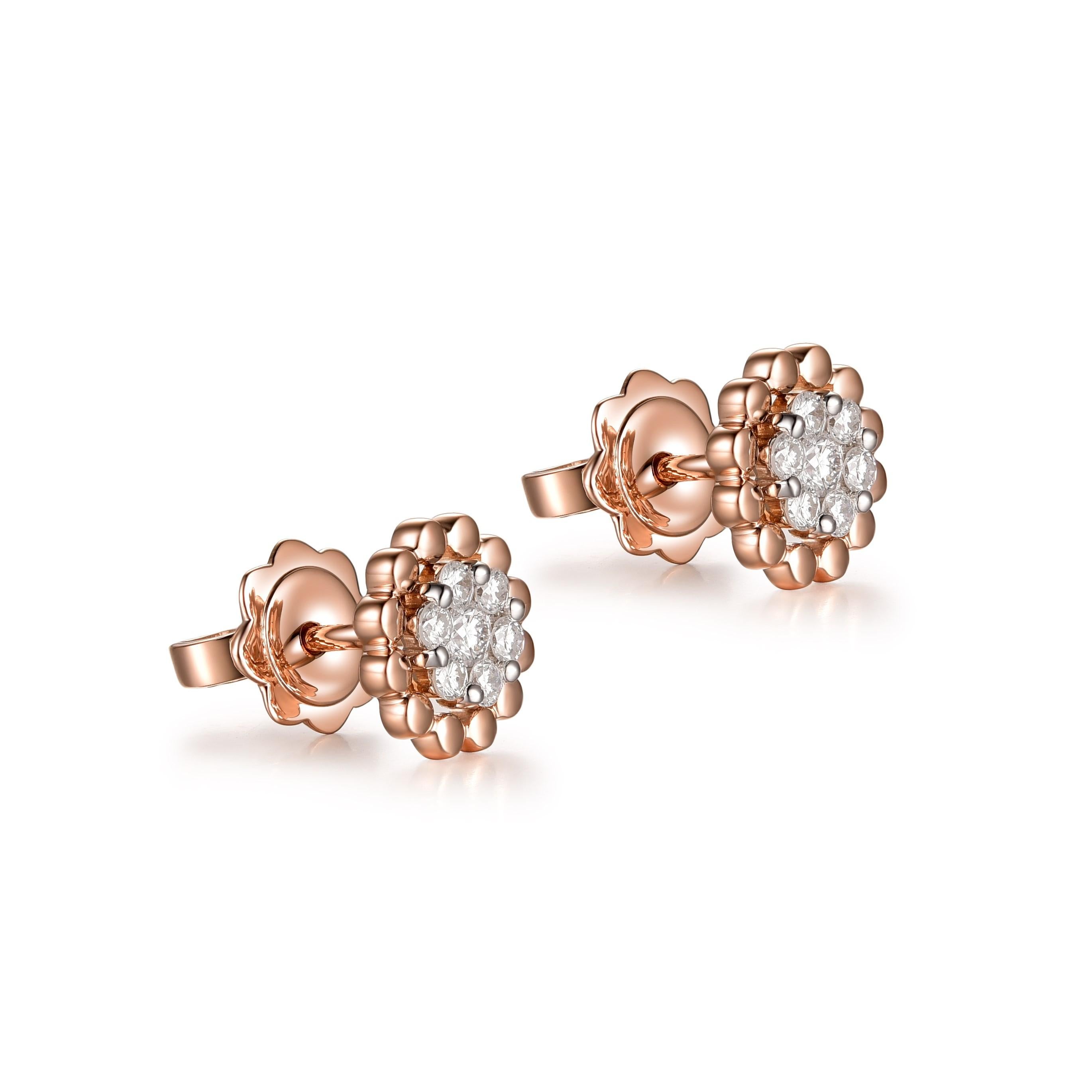 
The earrings depicted are a charming pair of 18K rose gold diamond studs, exuding contemporary elegance and classic charm. Each earring features a cluster of round brilliant-cut diamonds, meticulously arranged to form a dazzling centerpiece with a