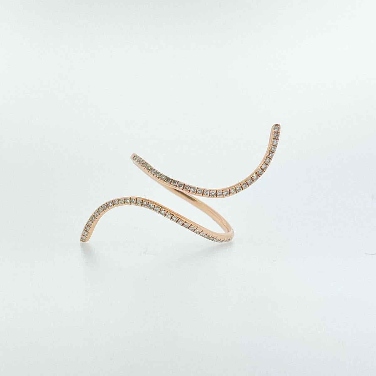 Make a statement with this 18K Rose Gold Diamond Wrap Ring. The ring holds Sixty-Four Round Diamonds Weighing 0.23ctw (G/SI in Quality) and is currently sized at a 7.5 but can be resized to fit. 