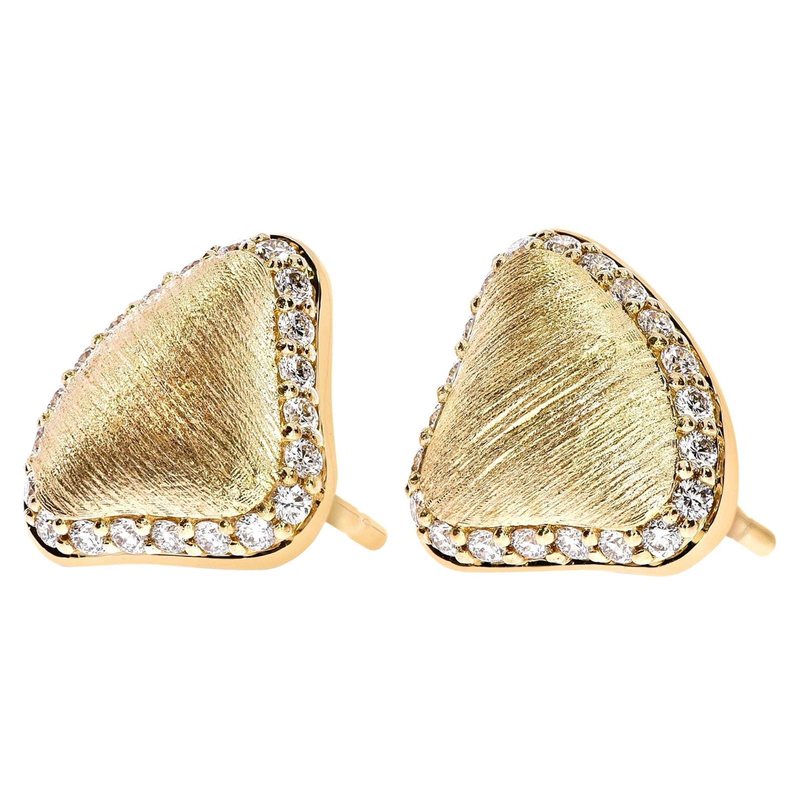 This pair of studs are hand textured to give you that brushed detail and it's shown here in 18K Rose gold and the edges are expertly lined with 0.40cts of G VS white brilliant cut diamonds. The stoppers are set in an easy wear cap.