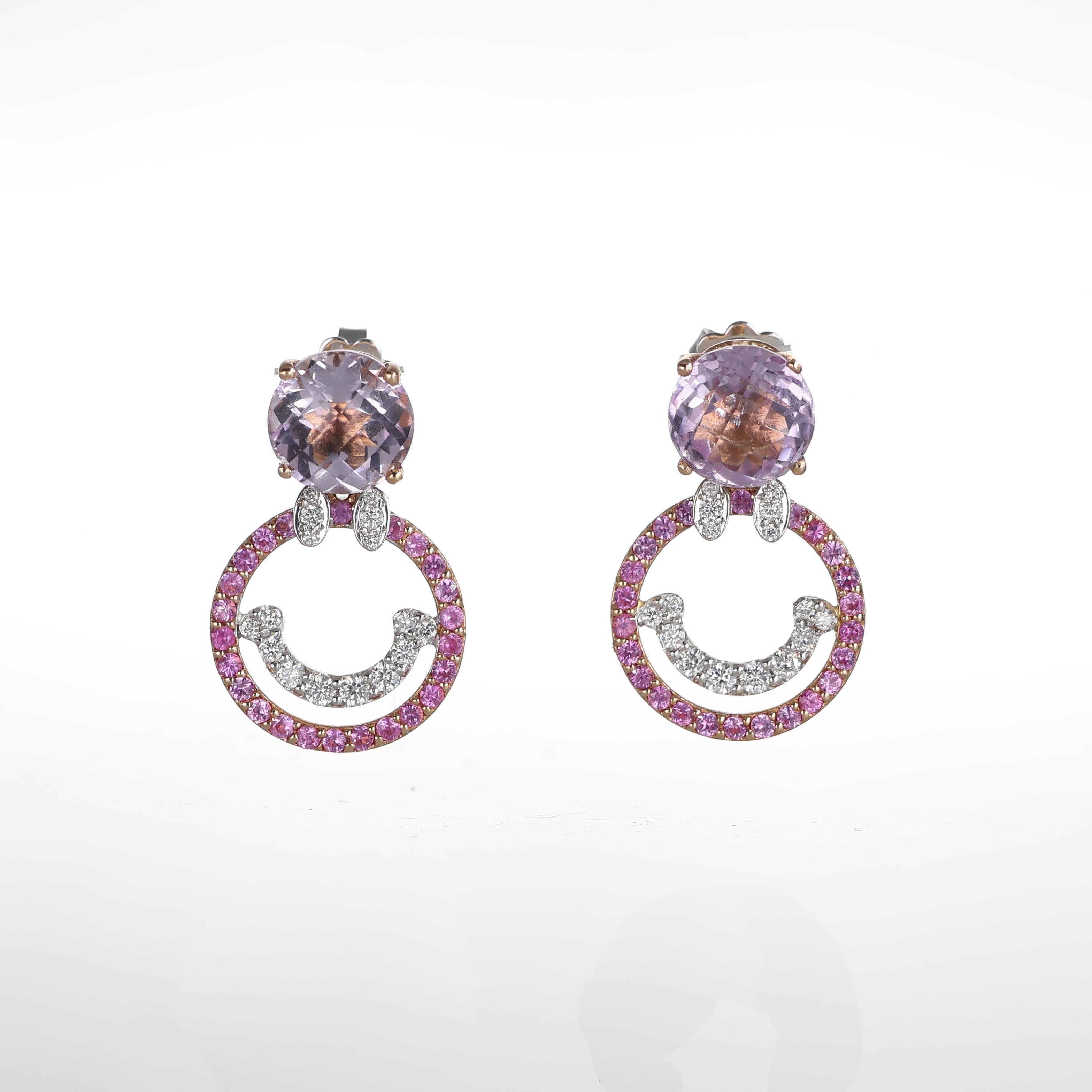 These playful yet sophisticated 18k rose gold earrings feature a brilliant round-cut amethyst as the centerpiece, elegantly perched on the earlobe. Below, a charming 