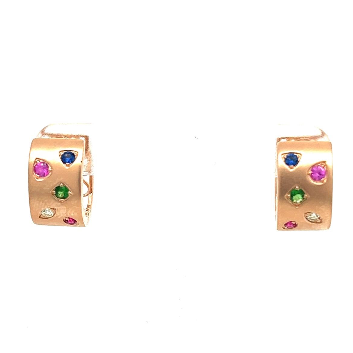 18K Rose Gold Earrings with Multi-Color Gemstones and Diamonds
2 Blue Sapphires - 0.08 CT
2 Diamonds - 0.05 CT
2 Green Garnets - 0.10 CT
2 Pink Sapphires - 0.11 CT
2 Rubies - 0.05 CT
18K Rose Gold - 6.36 GM
The artisans and designers at Althoff