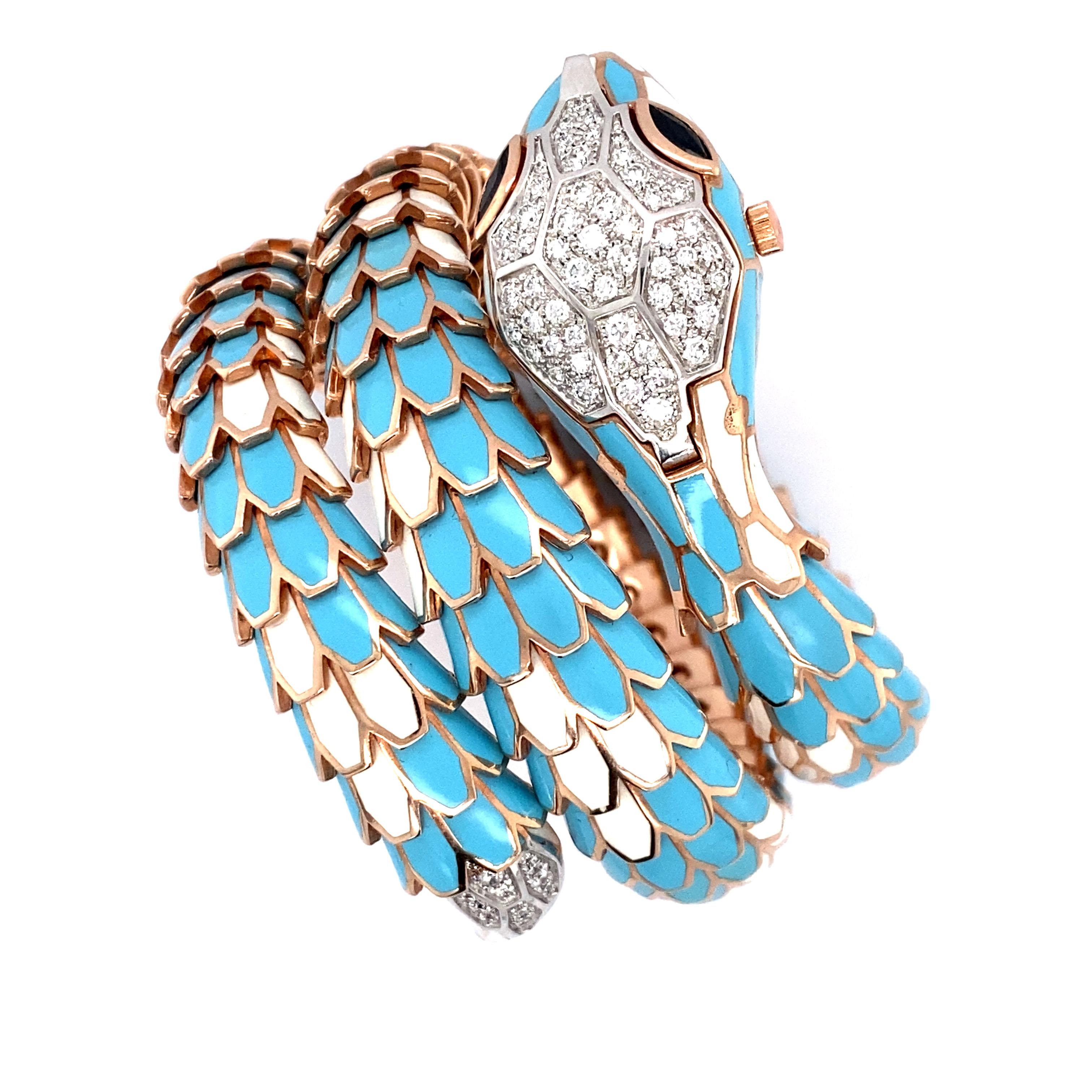 AN 18K ROSE GOLD, STERLING SILVER, ENAMEL, SAPPHIRE AND DIAMOND WRISTWATCH BANGLE, ITALY
Designed as a snake, with a hidden dial beneath the snake's head, the eyes set with marquise-shaped sapphires, the scales topped with light blue enamel, further