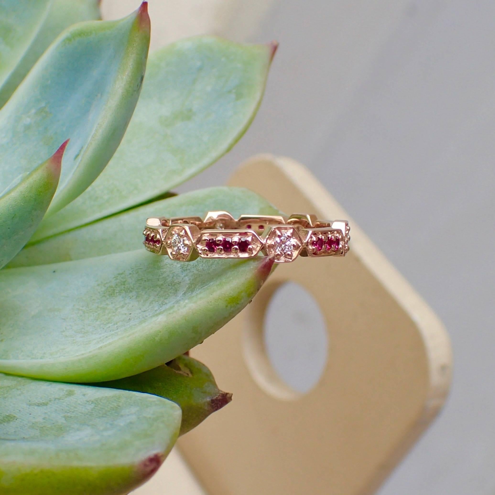 18k Rose Gold Eternity Band with six (6) Round Brilliant Cut Diamonds that measure 2mm and weigh a total of 0.19 carats with Clarity Grade VS and Color Grade G and eighteen (18) Fine Rubies that measure 1.3mm and weigh a total of 0.20 carats and