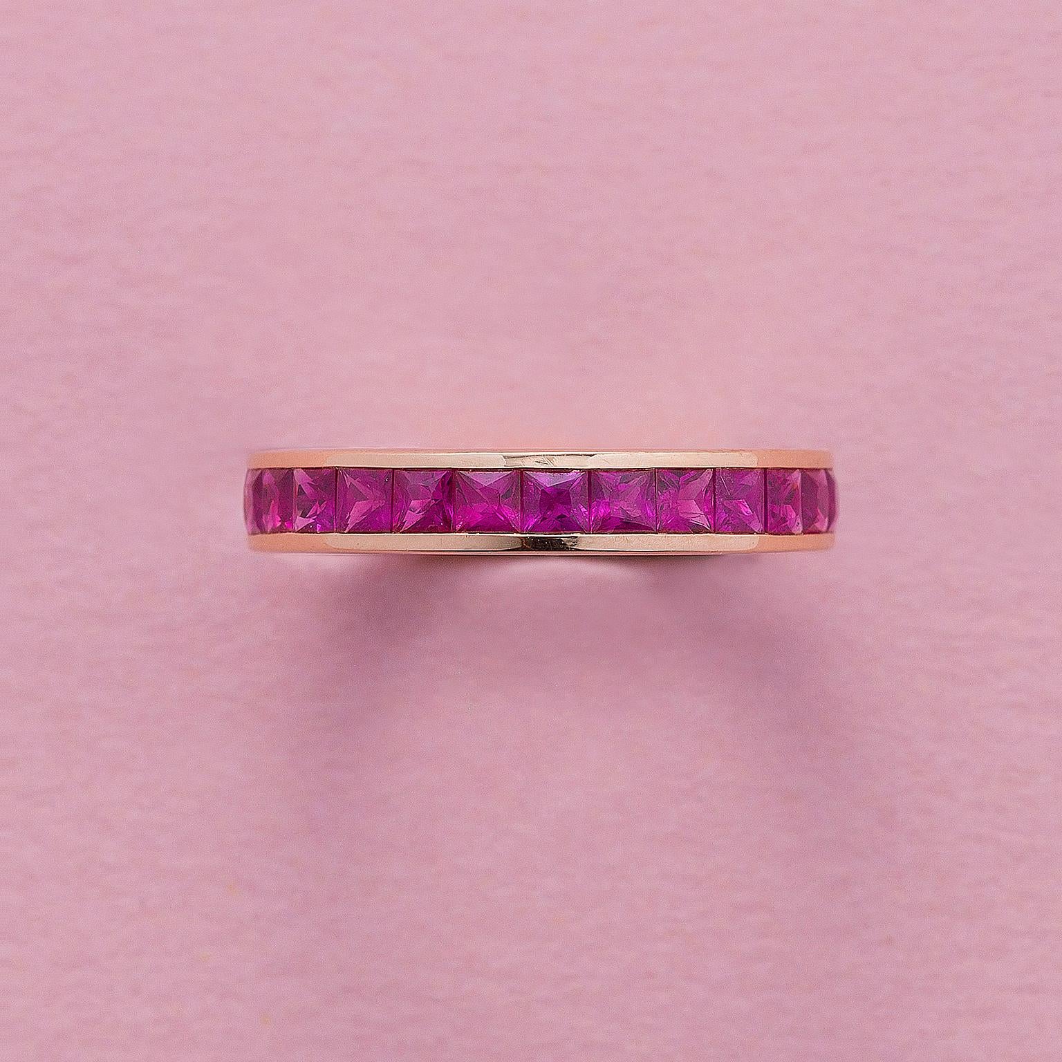 An 18 carat rosé gold eternity band ring with carré cut ruby (2.45 carat in total) set in a rails setting.
weight: 3.13 grams
ring size: 17 mm / 6 ¾ US
width: 3.7 mm