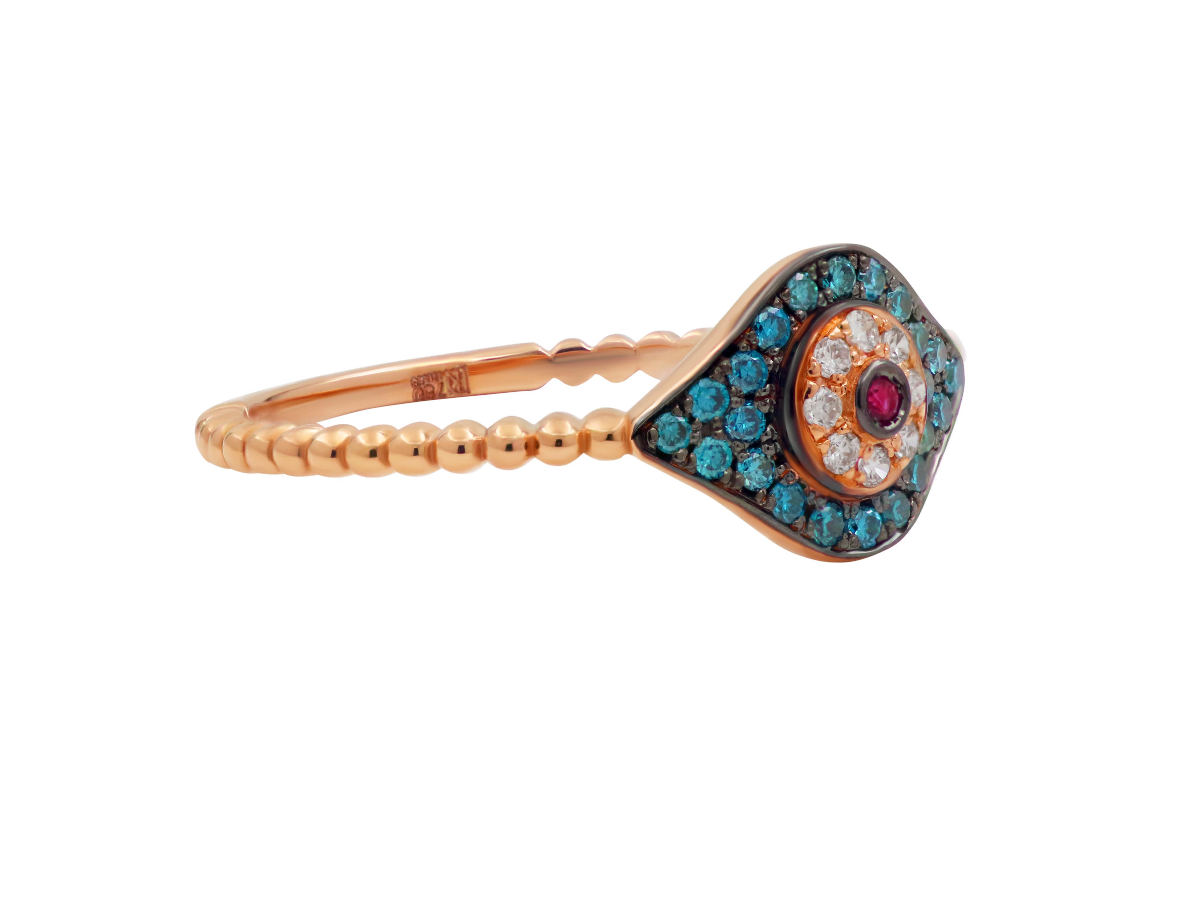 Dainty evil eye ring with in a small size set in 18k rose gold with 0.013 carats ruby, 0.12 carats blue diamonds and 0.042 carats brilliant cut white diamonds. 

Ring face: 0.314X0.393
