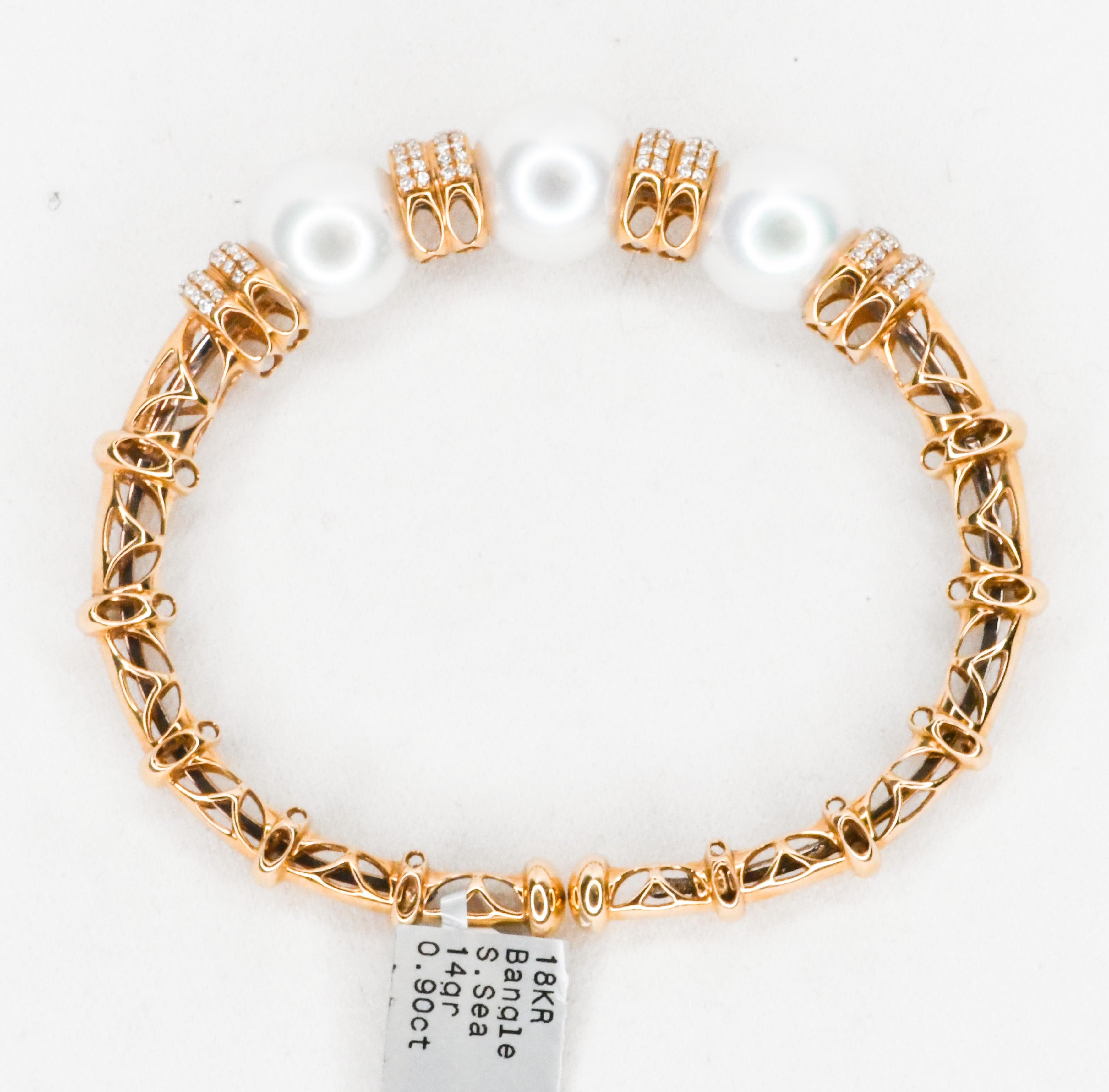 The warmth of 18 karat Rose Gold goes with all skin tones.  This stunning bracelet is so easy to put on or take off.  Very flexible open ends.  Adorned with three white and lustrous South Sea pearls measuring 14mm.  Pearls are flanked and separated