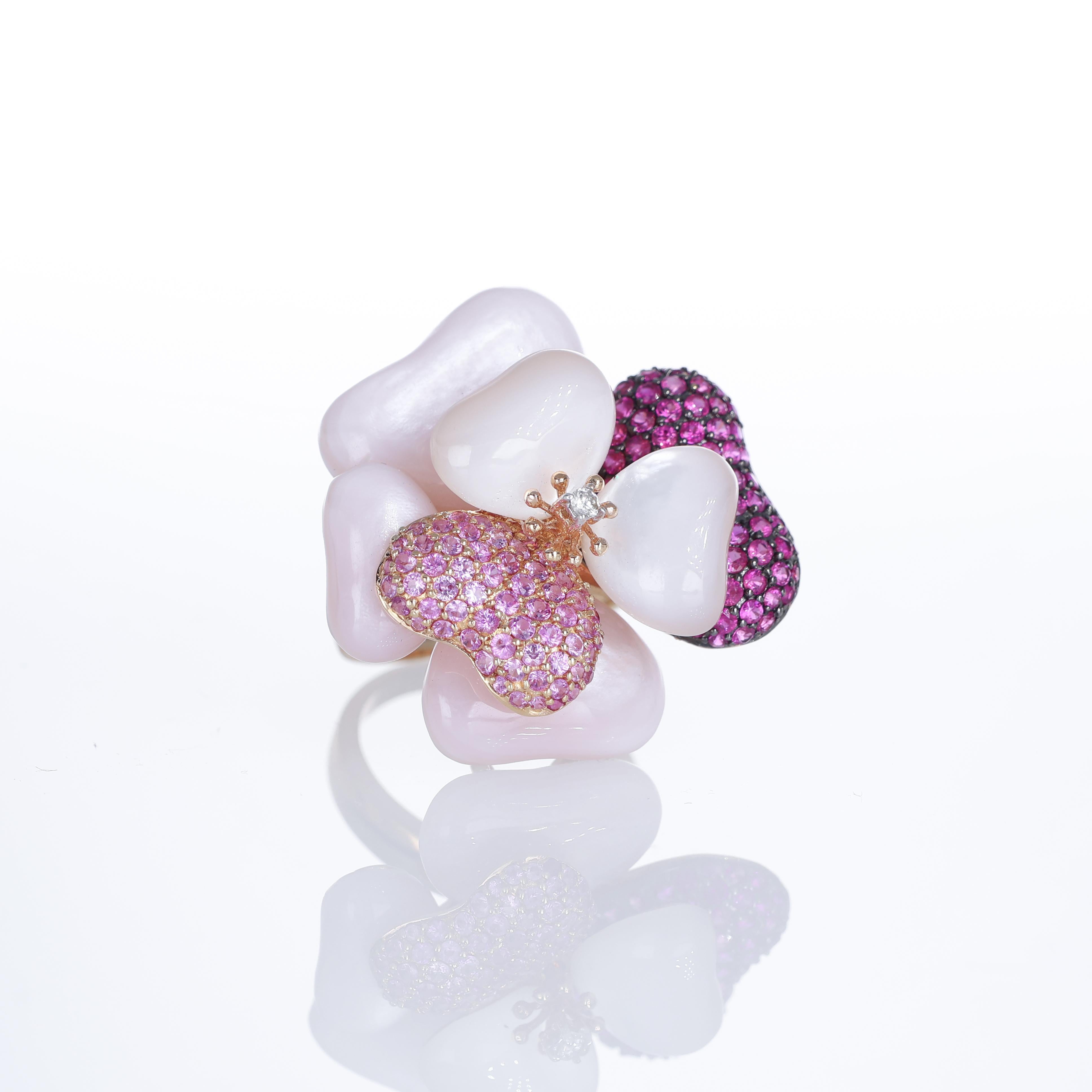 Elegant and contemporary, these 18K rose and white gold drop earrings feature a refined interplay of geometric design and vibrant gemstones. A brilliant-cut diamond pavé accents the delicate structure, while pink sapphires add a touch of vivid