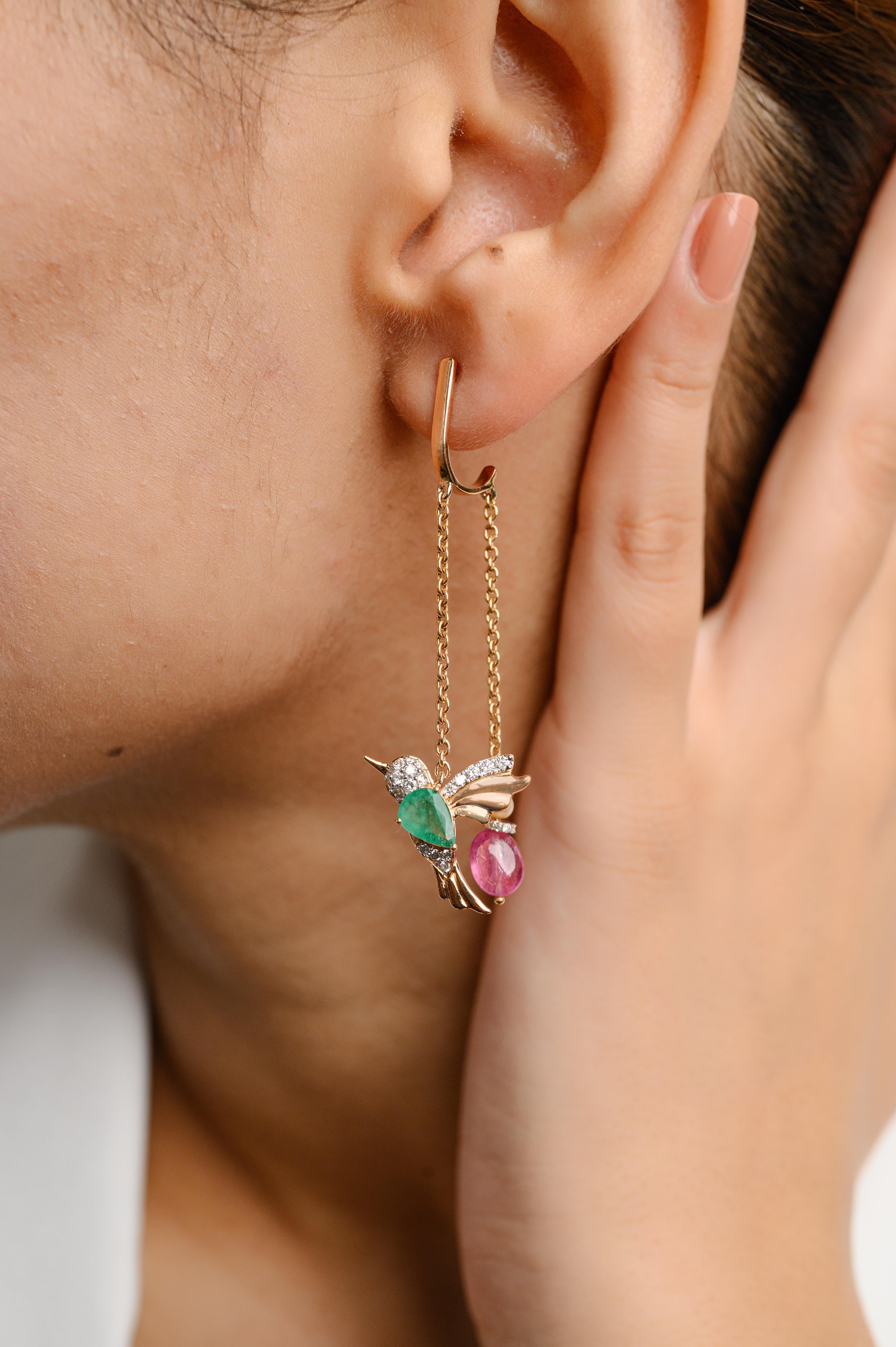 Flying Hummingbird Emerald and Ruby Chain Earrings in 18K Gold with Diamonds to make a statement with your look. These earrings create a sparkling, luxurious look featuring mix cut gemstone.
Emerald enhances the intellectual capacity and ruby