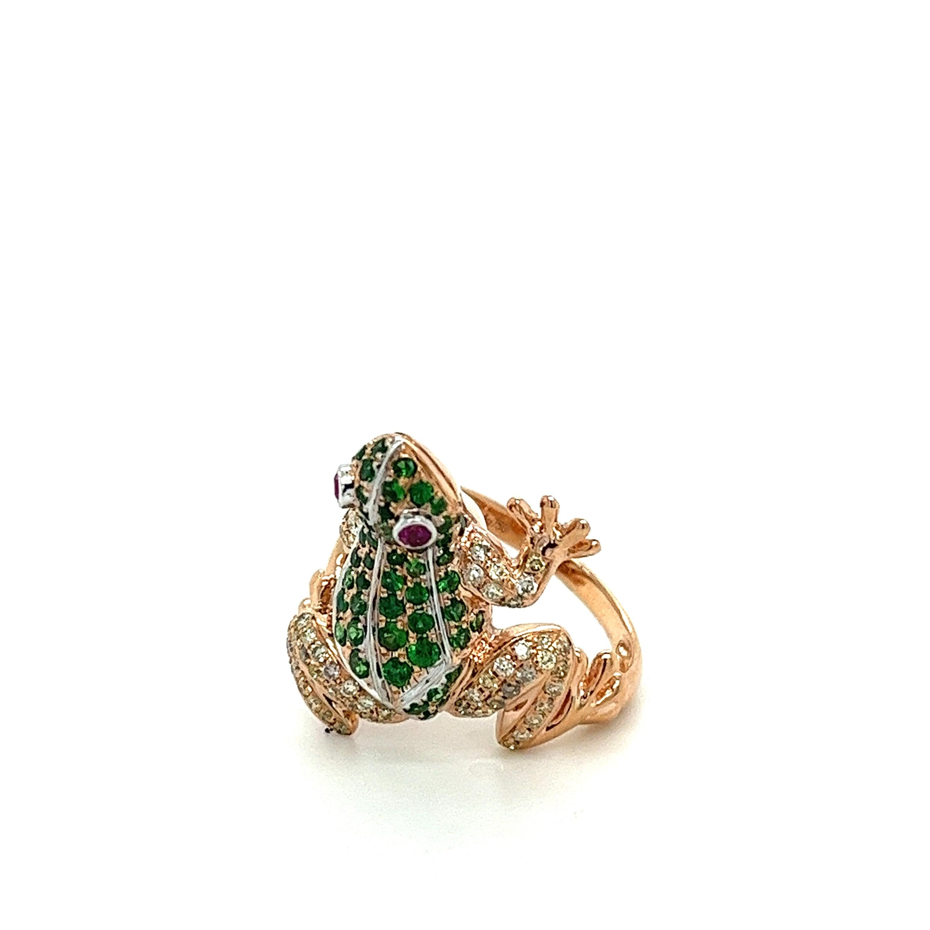 18K Rose Gold Frog Ring with
Diamonds & Green Garnets
53 Diamonds - 0.39 CT
64 Green Garnets - 0.84 CT
2 Rubies - 0.07 CT
18K Rose Gold - 6.47 GM

Introducing the enchanting allure of our 18K Rose Gold Frog Ring. Embellished with a mesmerizing dance