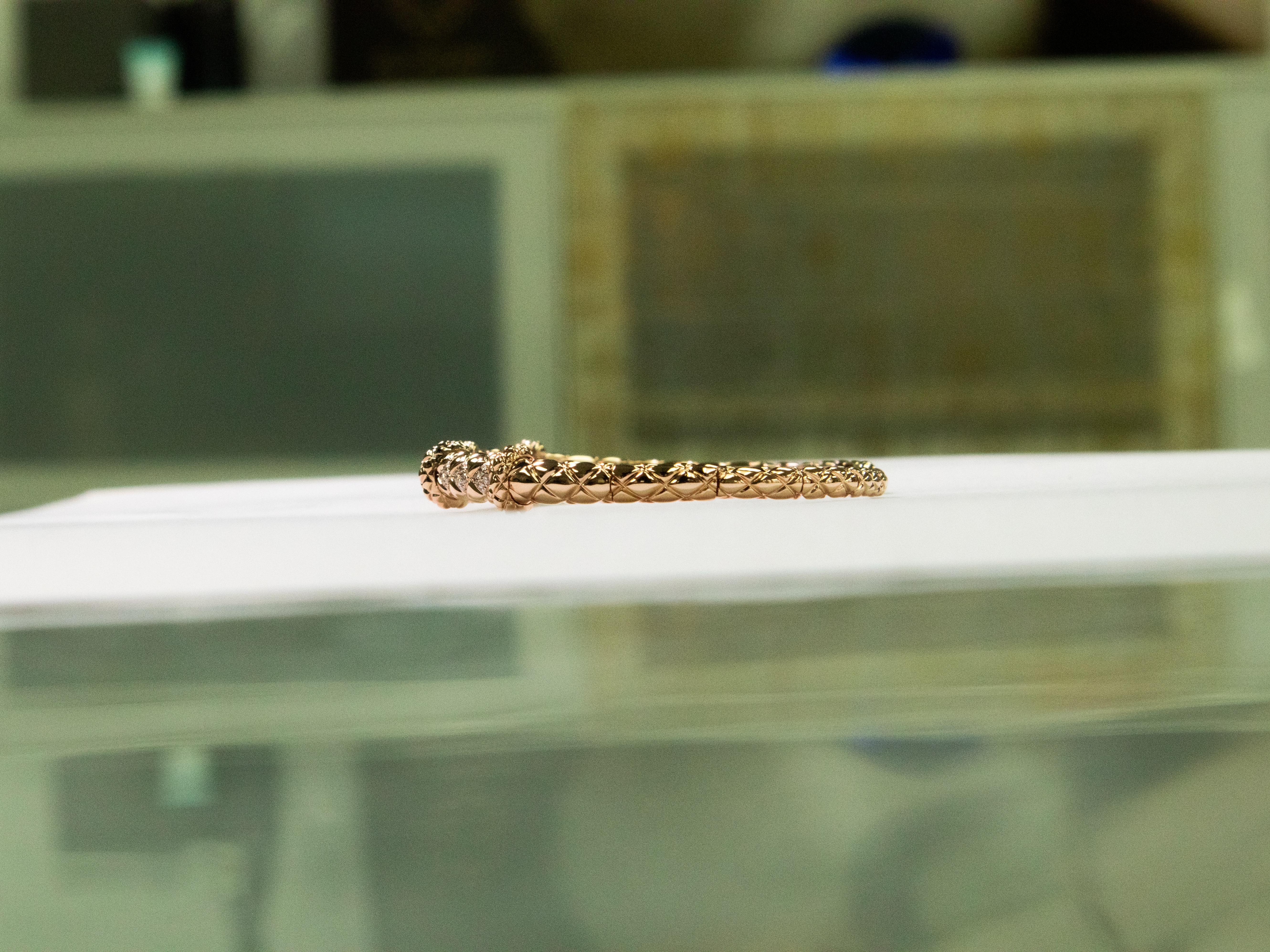 •	Metal: 18K Rose Gold 
•	Weight: 13.44gm 
•	Gemstones: Natural Diamonds
•	Total Diamond Weight: 0.37 ct (36 stones)
•       Diameter of bracelet: 1.8 inch - 2.3 inch
A refined expression of grace and renewal, this 18K rose gold bangle features 36