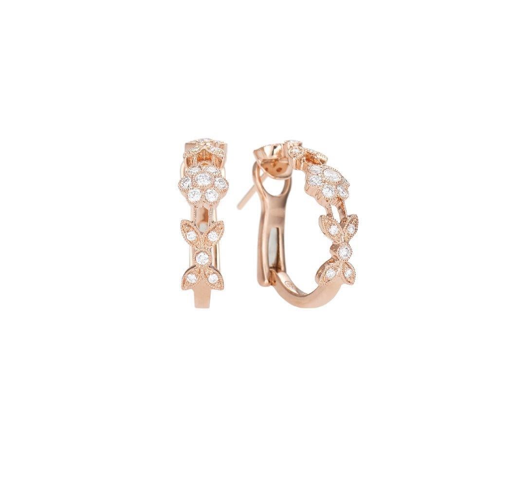 Heritage huggie earrings, crafted in 18k rose gold. Flower design with millgrain edges. 34 round brilliant cut diamonds with a total of .20ctw. 