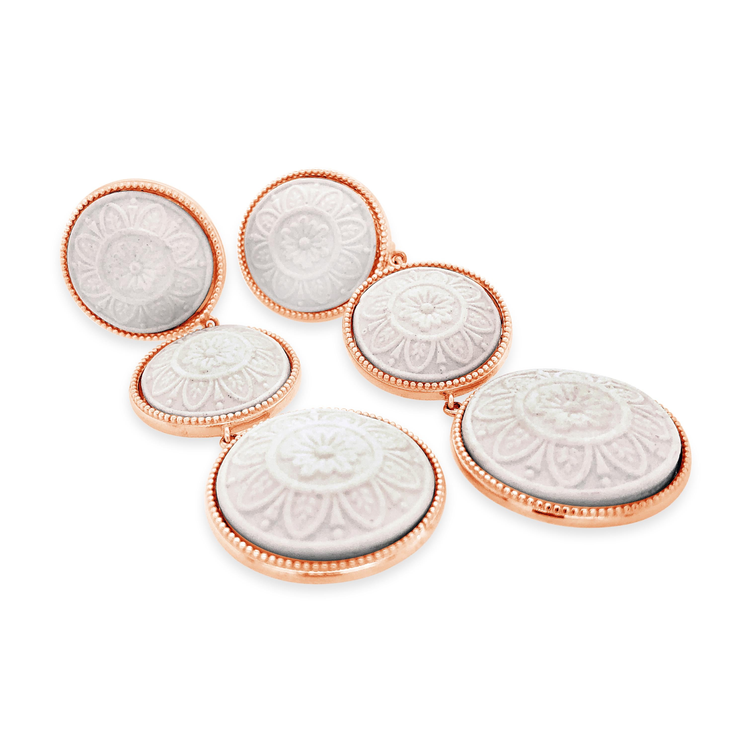 Beautifully hand crafted porcelain cameo earrings mounted in 18k rose gold vermeil. In times past, cameos were mainly made of shells, hardstones, coral and volcanic rock, instead today the cameos which bears our family’s signature are made of fine