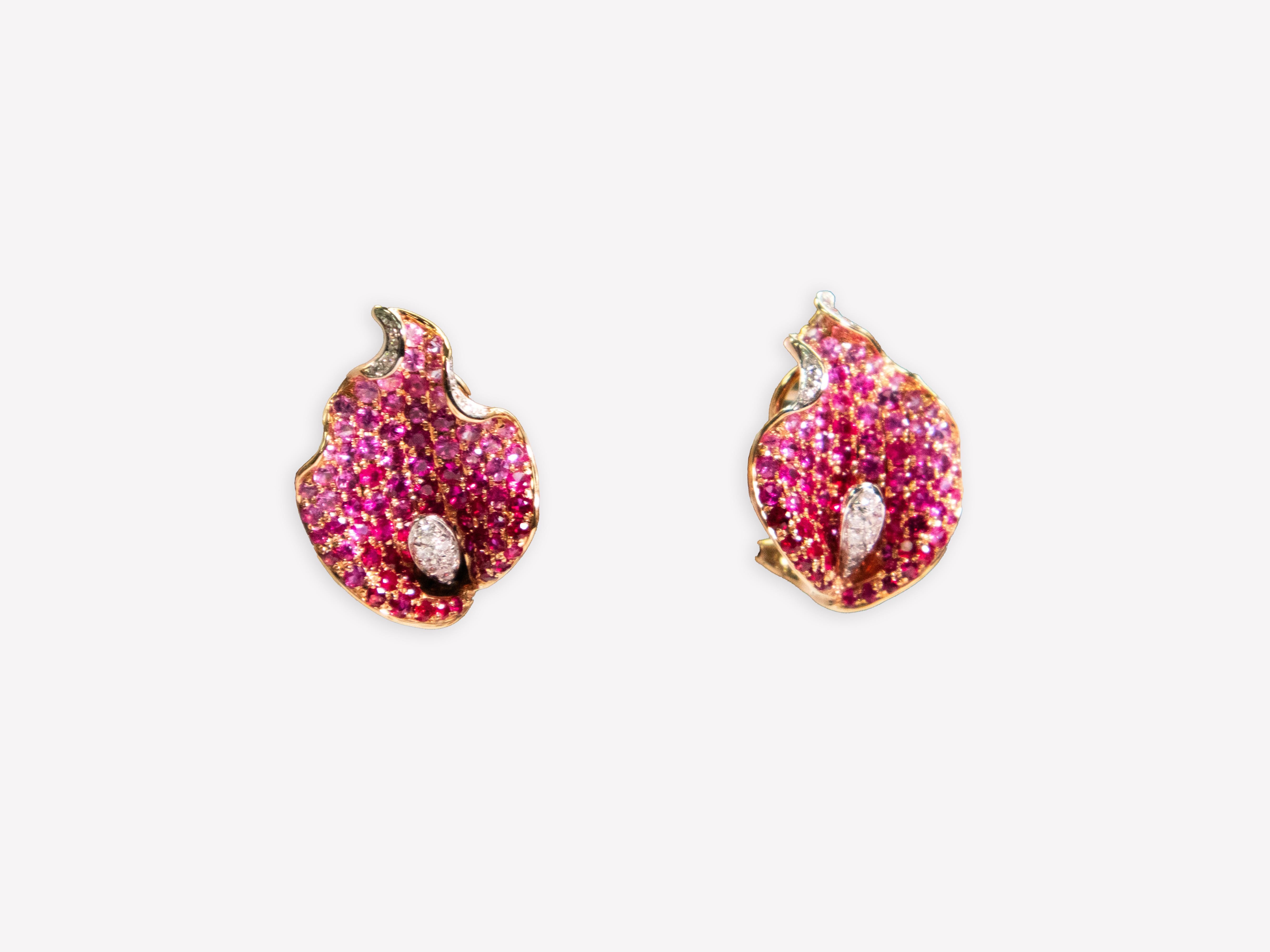 18K Rose Gold  Leaf Earrings with Ruby & Pink Sapphire

Delicate and feminine, these leaf-shaped earrings showcase a breathtaking fusion of rubies and pink sapphires, set in warm 18K rose gold. Inspired by nature’s beauty, they exude an air of