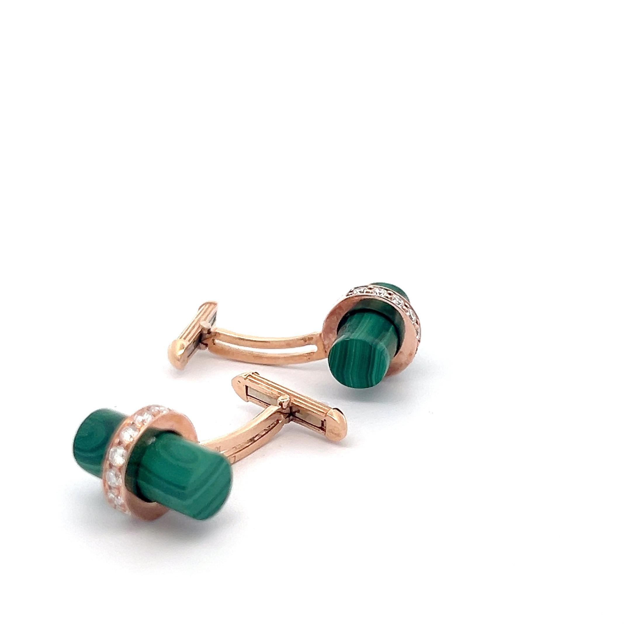 These exquisite cufflinks are crafted from luxurious 18k rose gold, offering a sophisticated and warm hue. Each cufflink features a striking malachite tube, showcasing the stone's vibrant green striations and natural beauty. Accentuating the