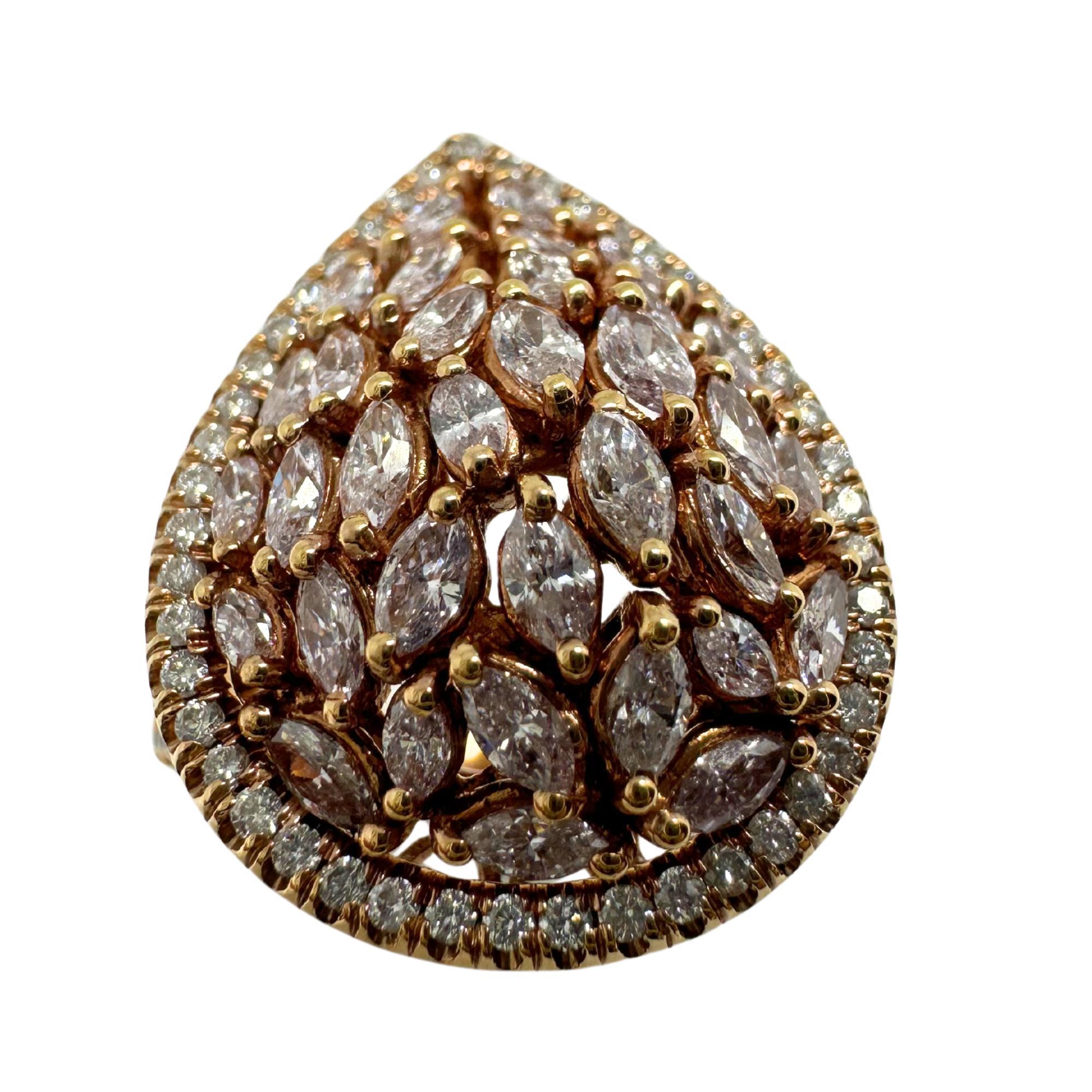 This 18K rose gold tear-drop dome ring features marquise-cut pink diamonds totaling 1.15 carats in a clustered design. A halo of white diamonds, weighing 0.43 carats, surrounds the center. The rose gold setting complements the pink diamonds.