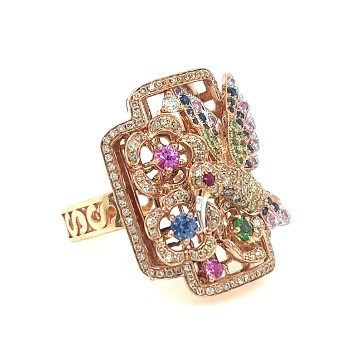 18K Rose Gold Multi-Color Sapphire Bird & Garden Ring with Diamonds

19 Blue Sapphires - 0.22 CT
158 Diamonds -  0.78 CT
13 Green Garnets - 0.17 CT
14 Pink Sapphires -  0.32 CT
1 Rubies - 0.02 CT
18K Rose Gold - 8.84 GM

This captivating ring