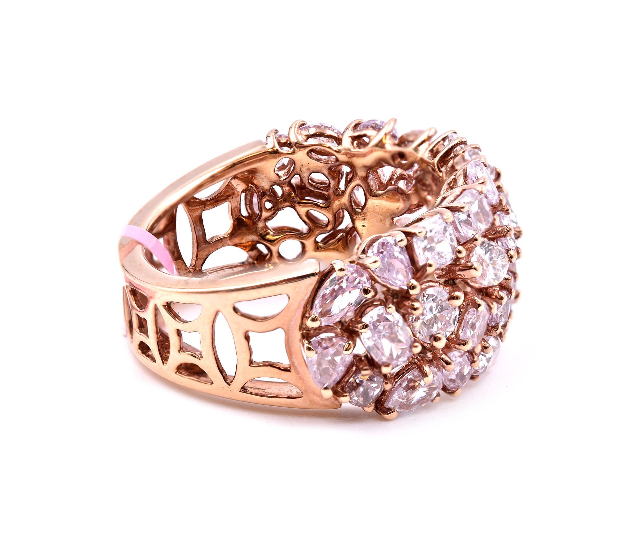 Designer: custom design
Material: 18k rose gold
Diamonds: 41 multi-shaped cuts= 3.49cttw
Color: pink
Ring Size: 6 ½ (please allow two additional shipping days for sizing requests)  
Dimensions: ring is 11.30mm wide
	

