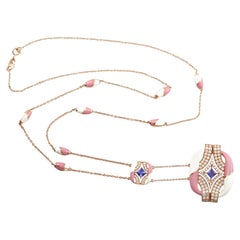 18 Karat Roségold Halskette mit Tansanit in der Mitte und rosa und weißen Keramik Stationen